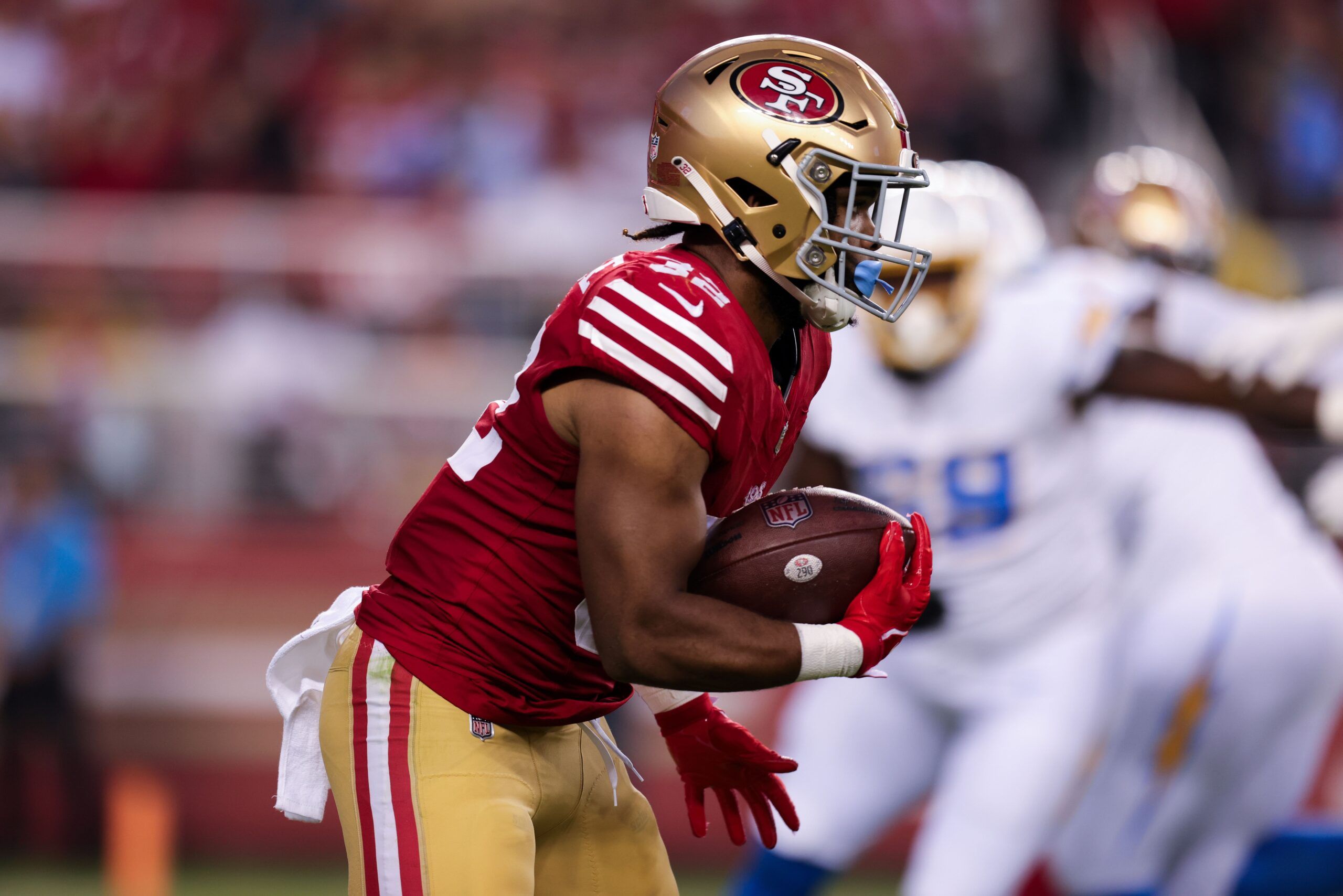 Tyrion Davis-Price (32) runs with the ball during the second quarter against the Los Angeles Chargers.