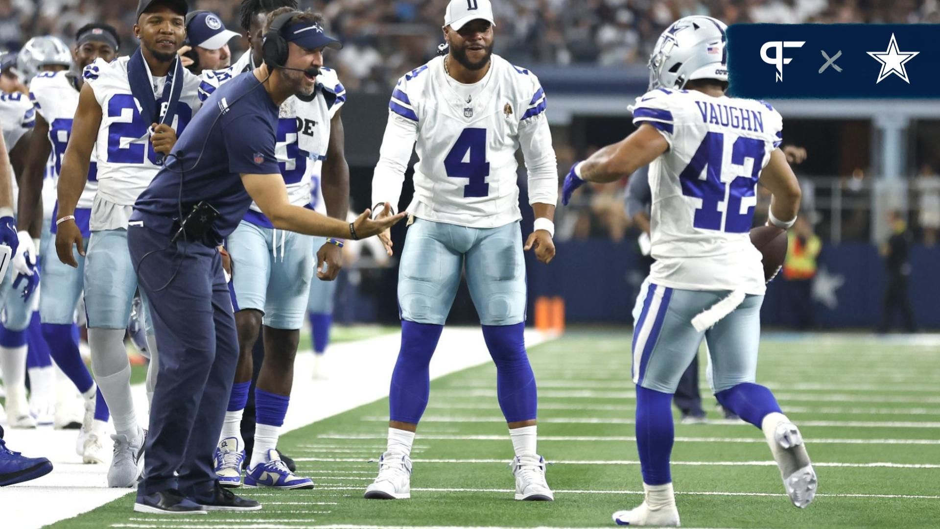  Dallas Cowboys offensive coordinator Brian Schottenheimer and quarterback Dak Prescott (4) and running back Deuce Vaughn (42) celebrate a touchdown in the fourth quarter against the Jacksonville Jaguars at AT&T Stadium.