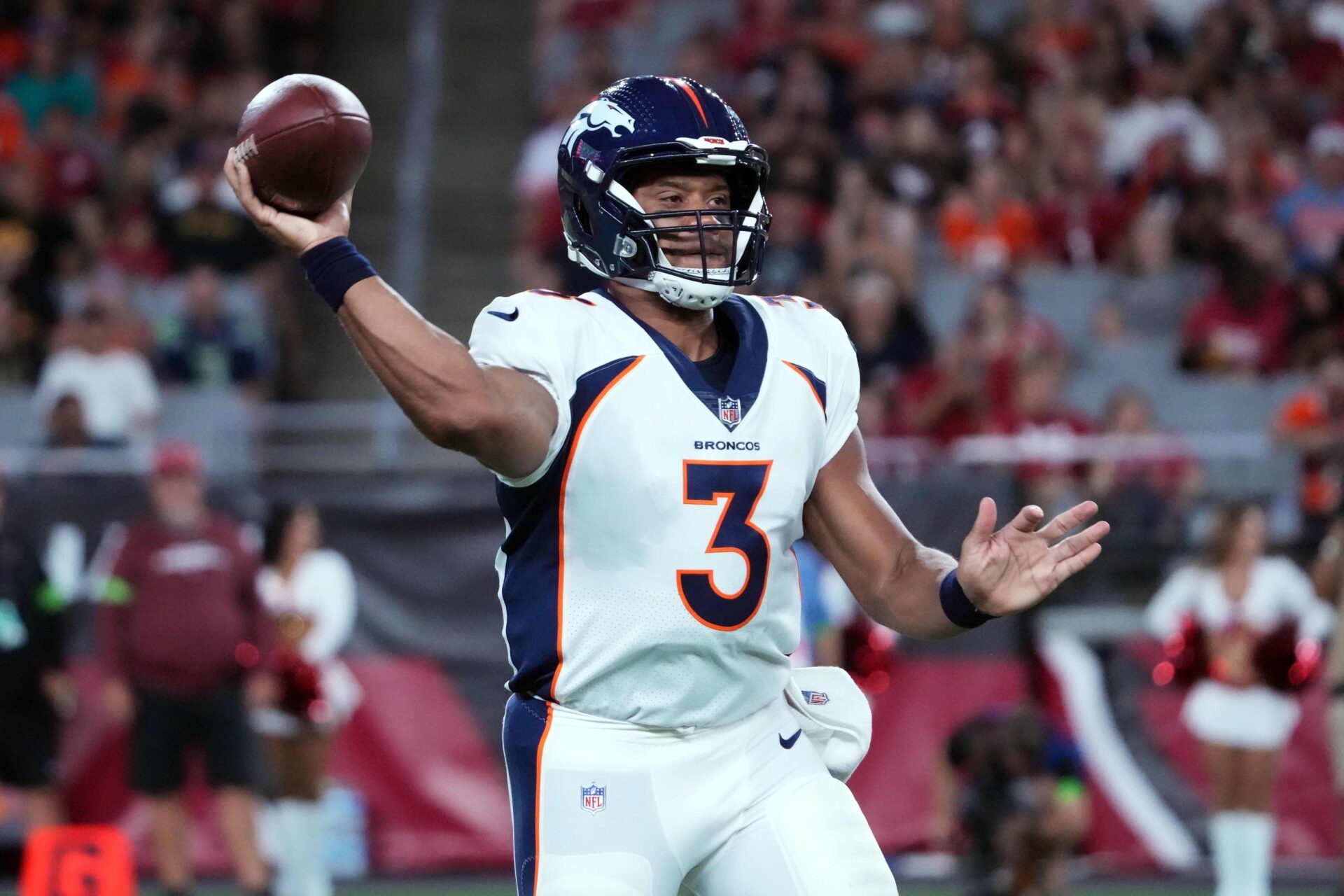 Russell Wilson (3) throws a pass against the Arizona Cardinals during the first half at State Farm Stadium.