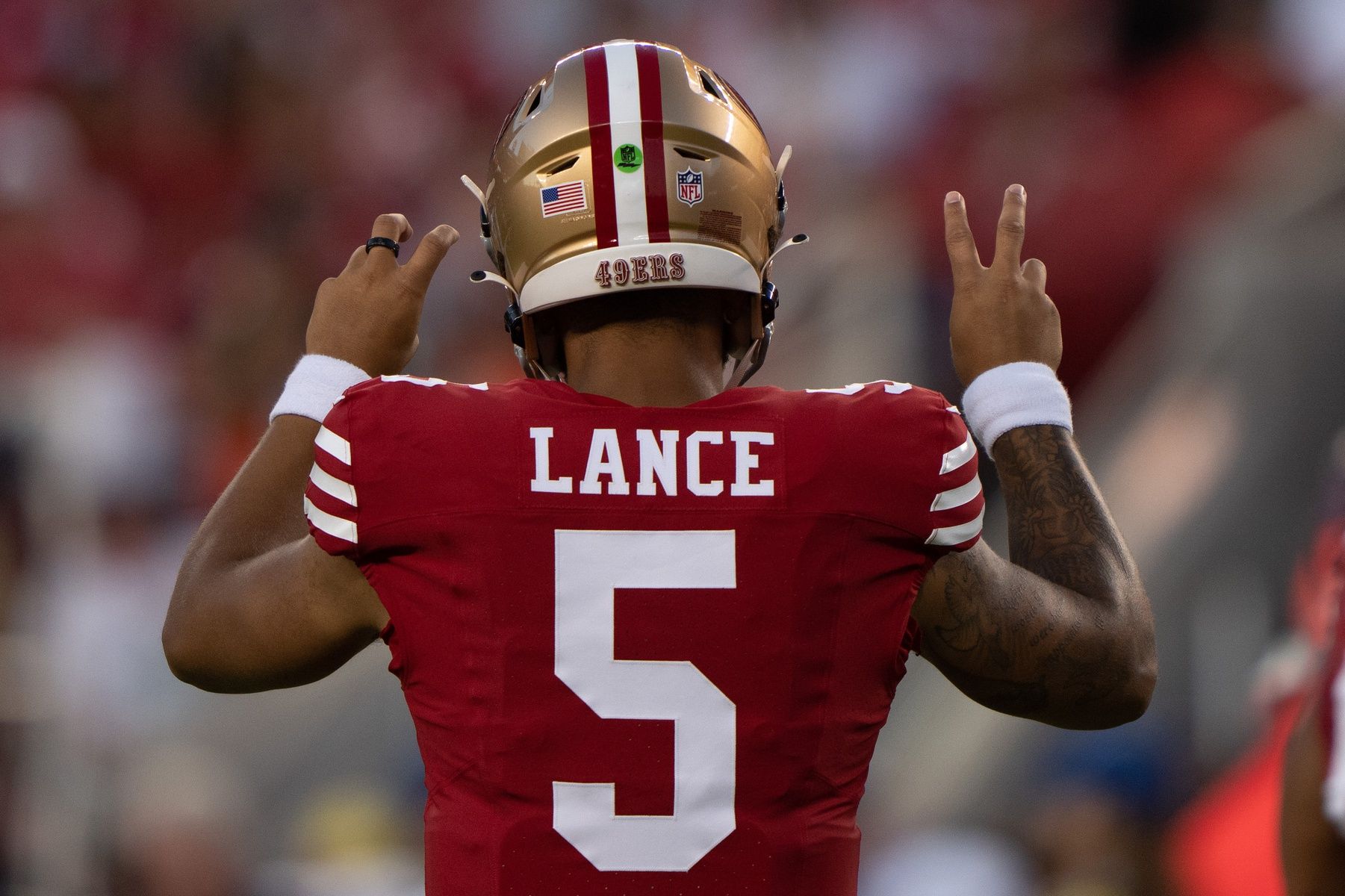 Trey Lance (5) signals during the third quarter against the Denver Broncos at Levi's Stadium.