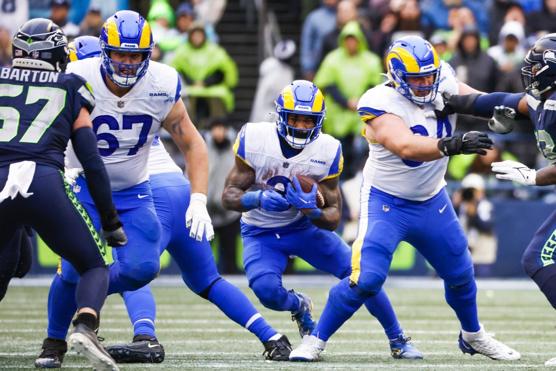 Los Angeles Rams running back Cam Akers (3) rushes against the Seattle Seahawks behind blocks from offensive tackle Chandler Brewer (67) and center Matt Skura (64) during the third quarter at Lumen Field.