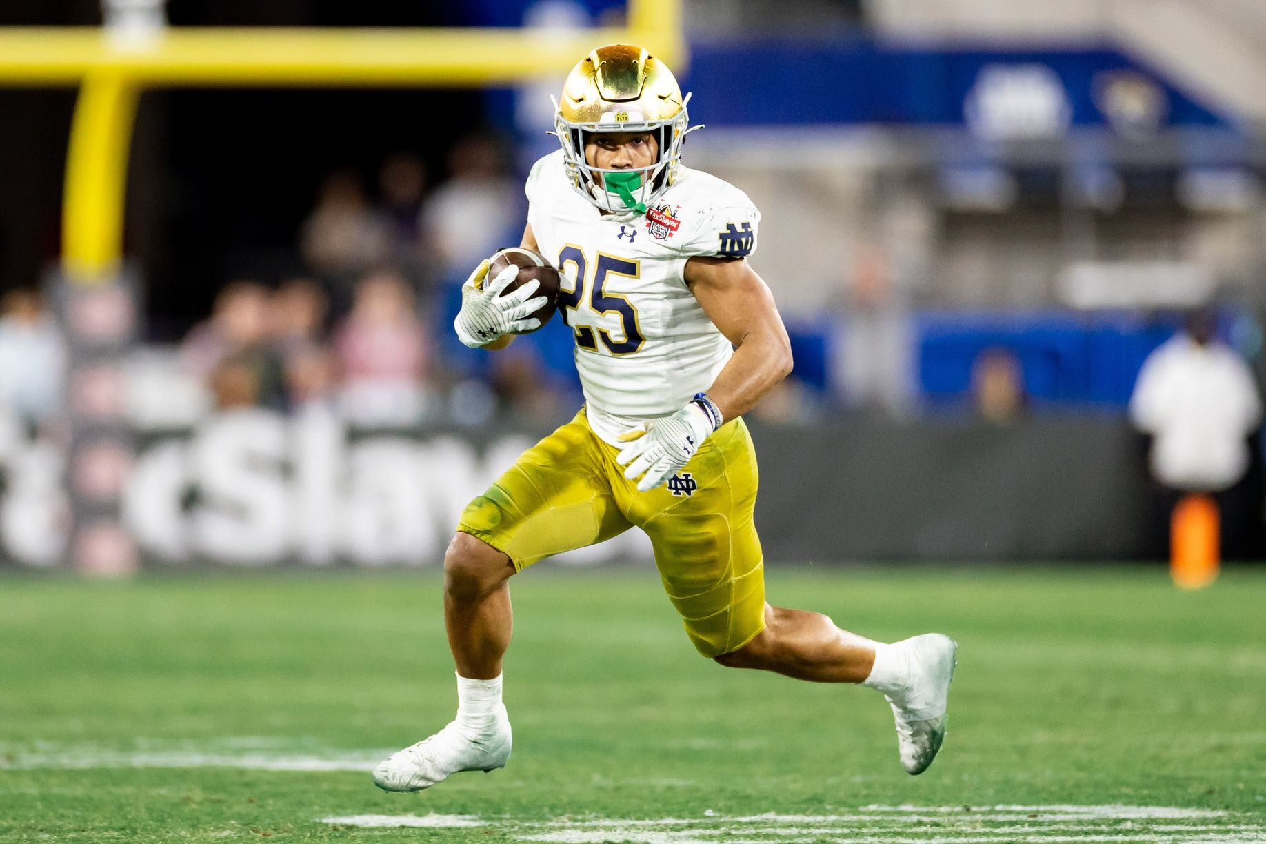 Chris Tyree (25) runs with the ball during the second half against the South Carolina Gamecocks in the 2022 Gator Bowl at TIAA Bank Field.