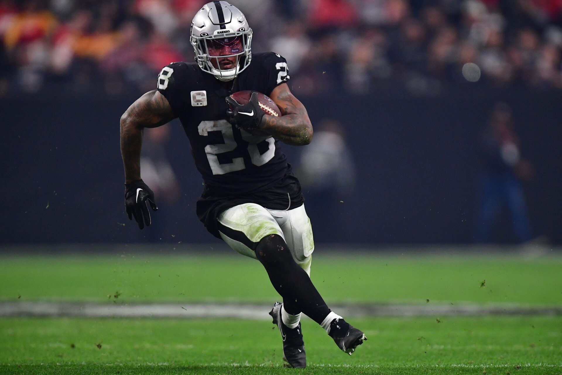 Las Vegas Raiders RB Josh Jacobs carries the football.