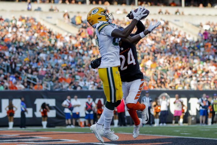 Green Bay Packers wide receiver Romeo Doubs (87) catches a touchdown against Cincinnati Bengals cornerback Sidney Jones IV (24) in the first half at Paycor Stadium.