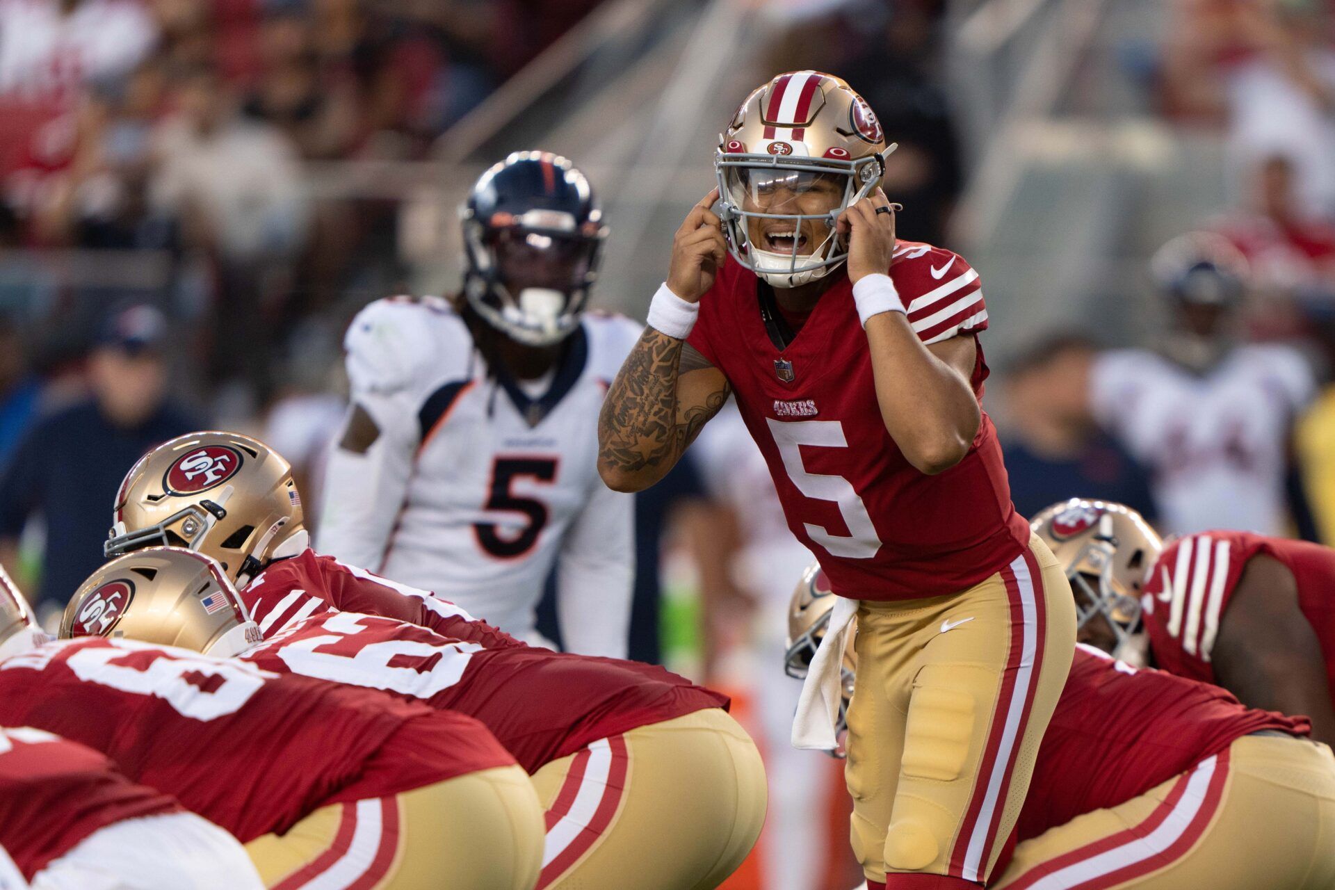 San Francisco 49ers QB Trey Lance (5) calls out a play against the Denver Broncos.