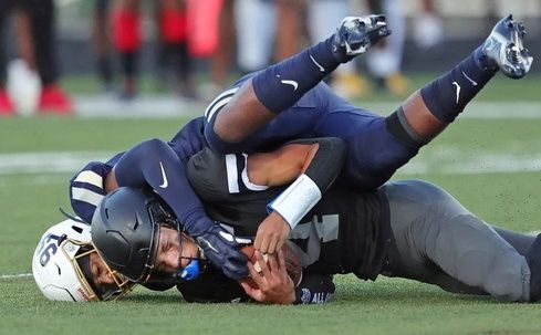 Bishop Sycamore quarterback Jailen Knight is sacked by Akron Archbishop Hoban defensive end Grant Thompson.