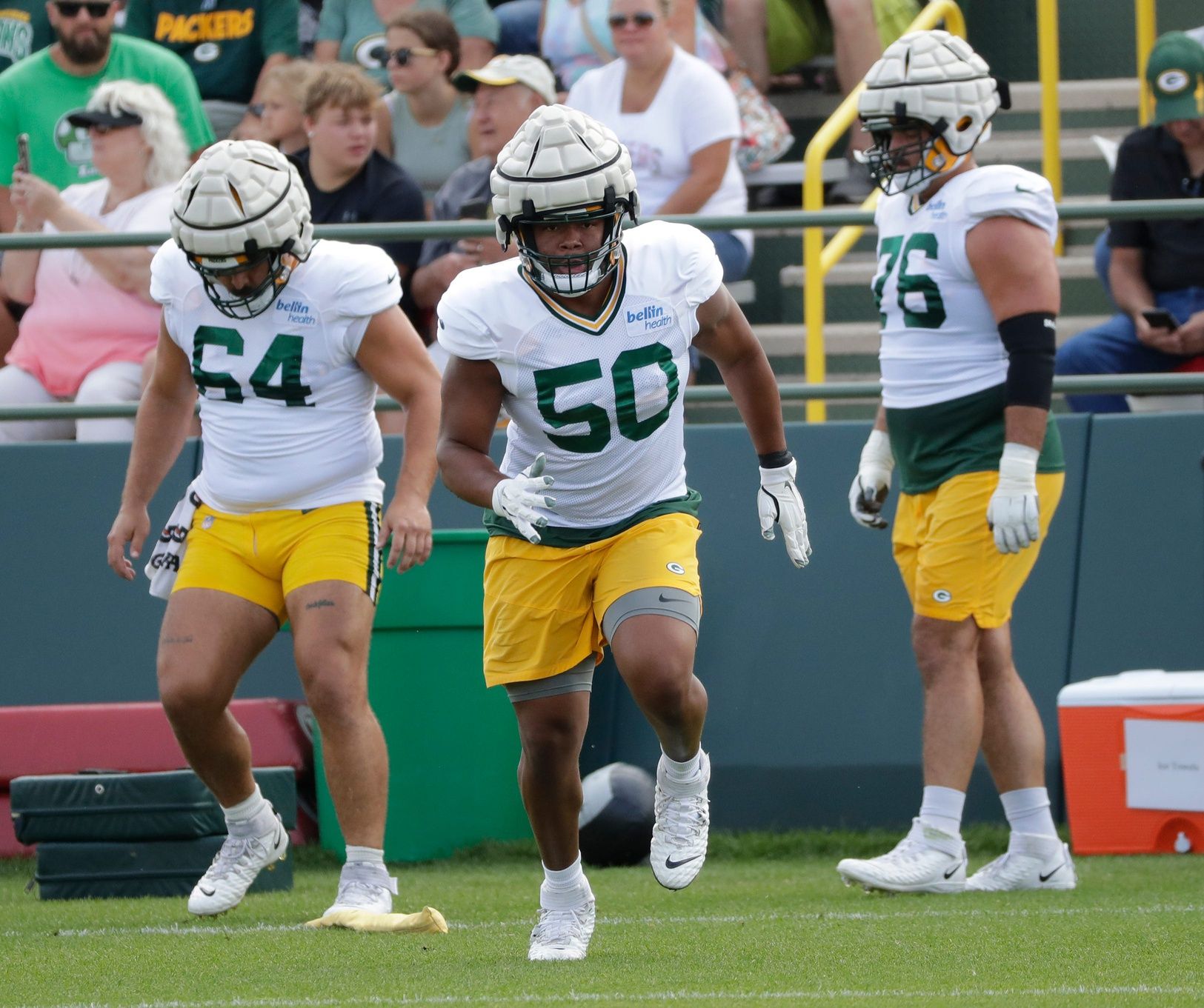 Cole Schneider (64), offensive lineman Zach Tom (50) and guard Jon Runyan (76) during training camp Monday, August 1, 2022, at Ray Nitschke Field.