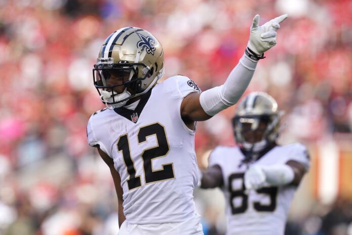 Chris Olave (12) gestures after making a play against the San Francisco 49ers in the second quarter at Levi's Stadium.