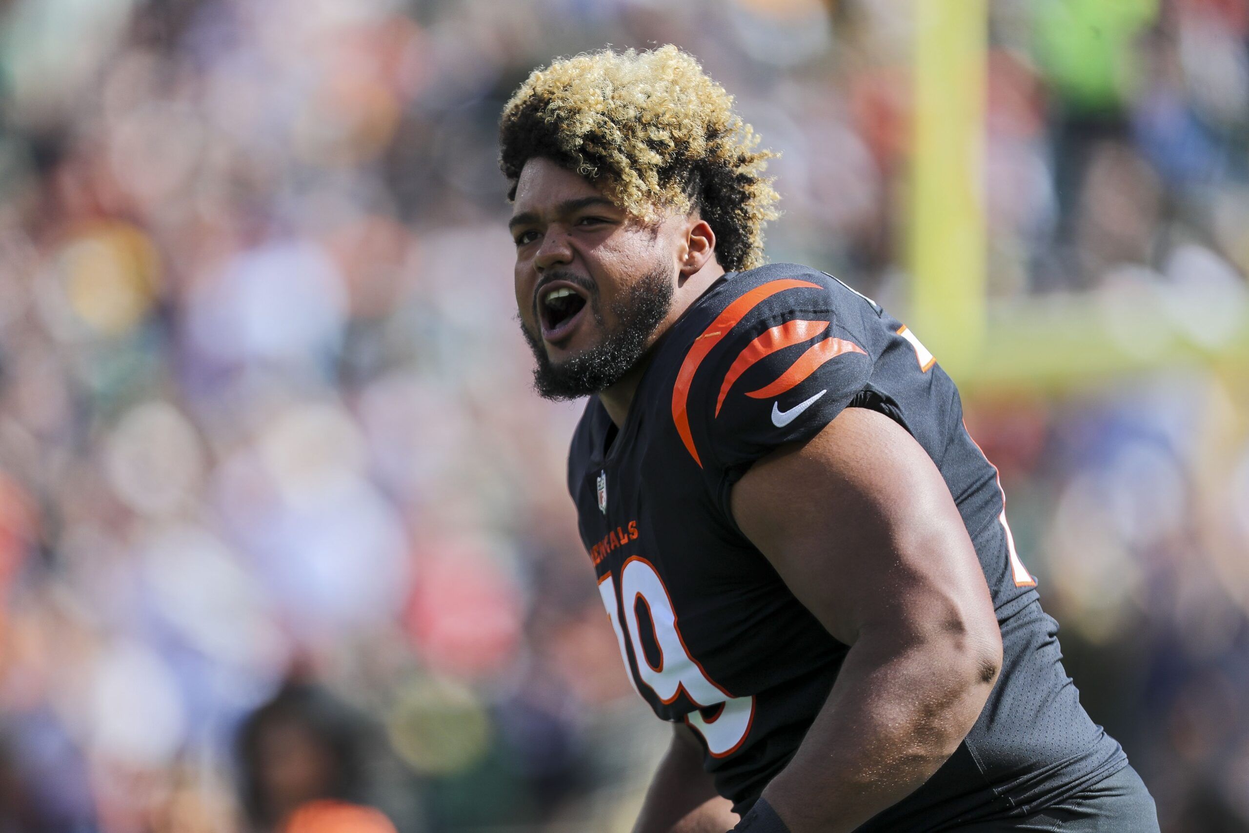 Jackson Carman (79) runs onto the field prior to the game against the Green Bay Packers at Paul Brown Stadium.