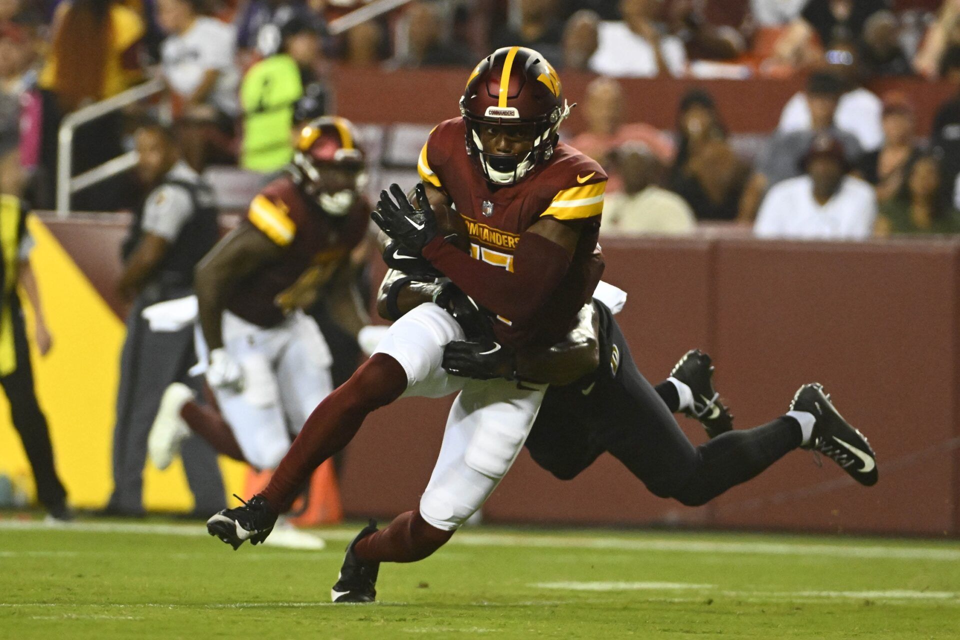 Washington Commanders wide receiver Terry McLaurin (17) runs after a catch during the first half at FedExField.