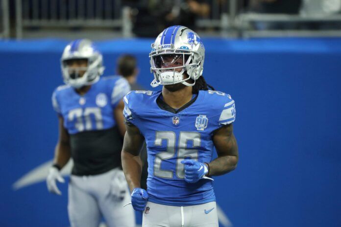 Jahmyr Gibbs (26) warms up before action against the Jacksonville Jaguars.