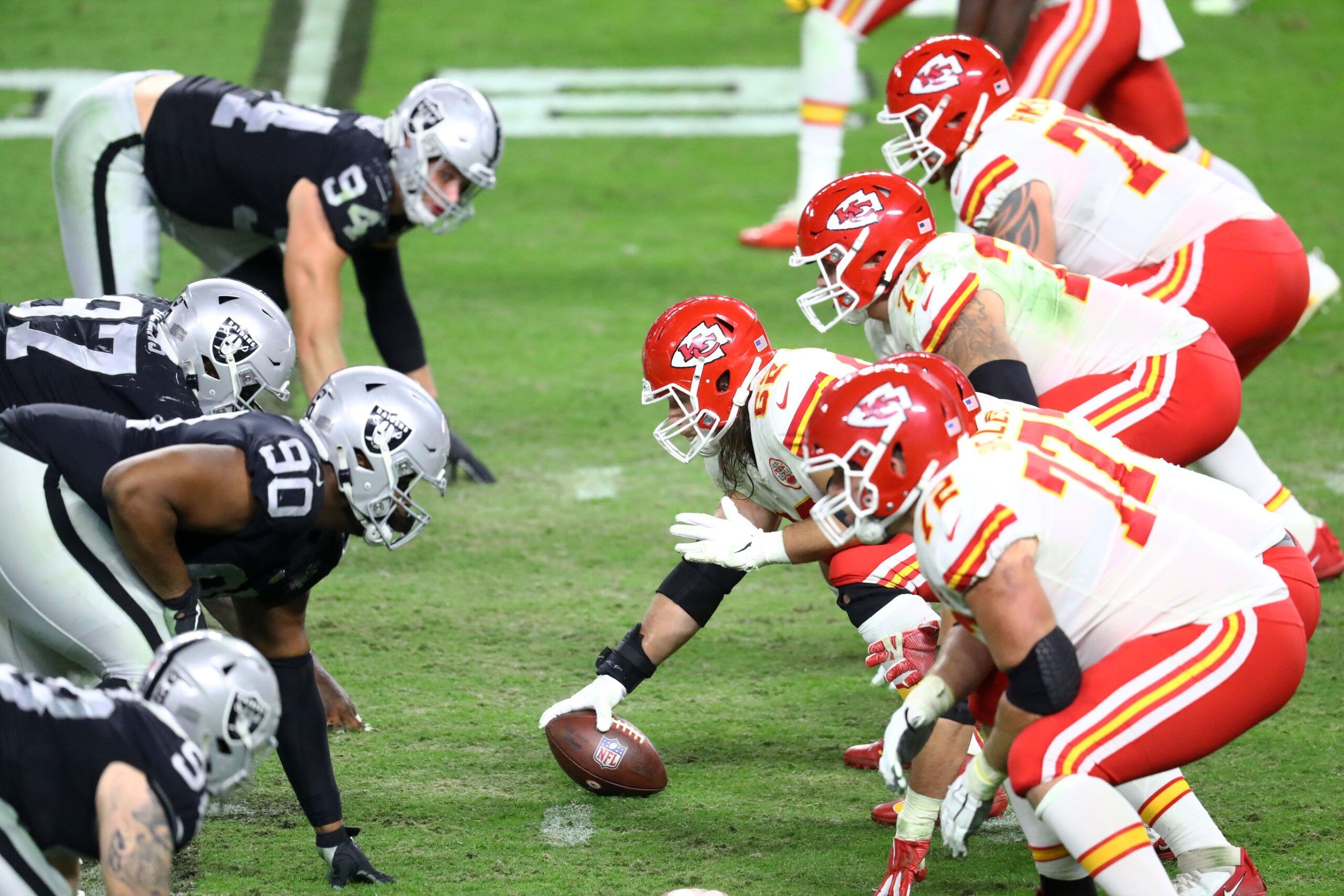 General view down the line of scrimmage as Kansas City Chiefs center Austin Reiter (62) prepares to snap the ball against the Las Vegas Raiders in the second half at Allegiant Stadium.