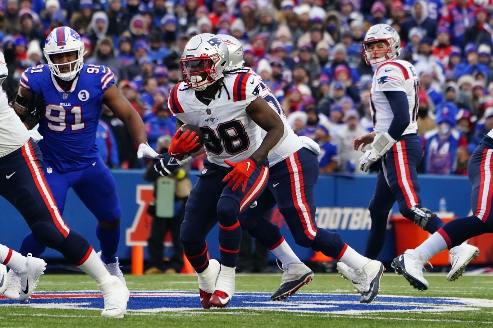Rhamondre Stevenson (38) runs with the ball against the Buffalo Bills during the second half at Highmark Stadium.