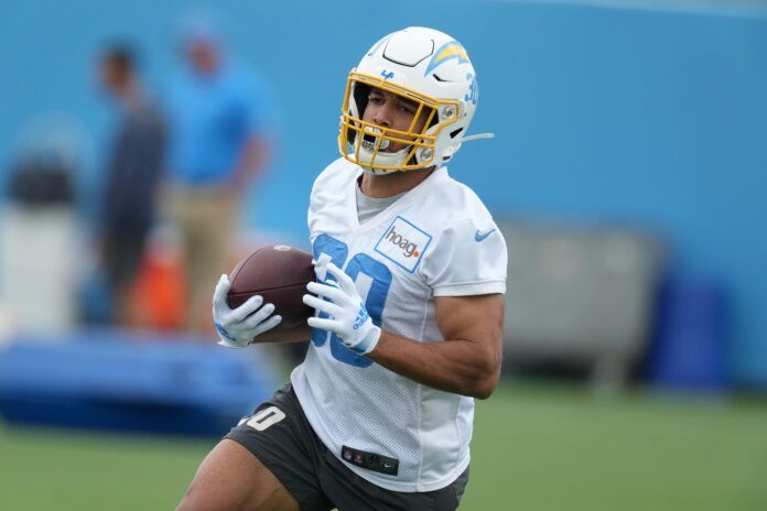 Austin Ekeler (30) carries the ball during minicamp at the Hoag Performance Center.