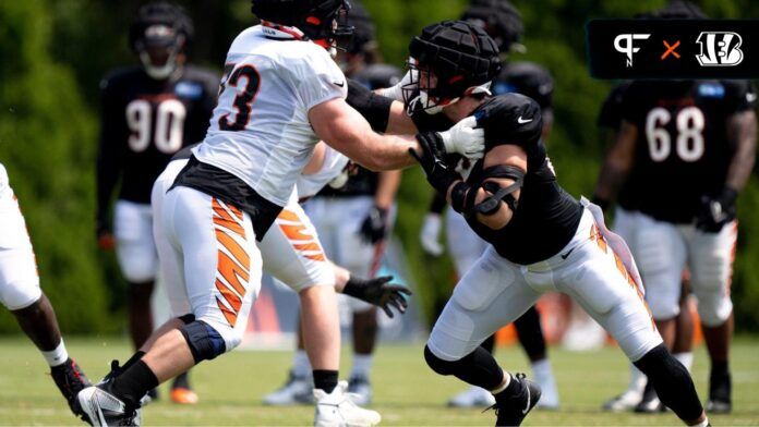 Cincinnati Bengals OT Jonah Williams (73) blocks DE Sam Hubbard (94) at practice during training camp.