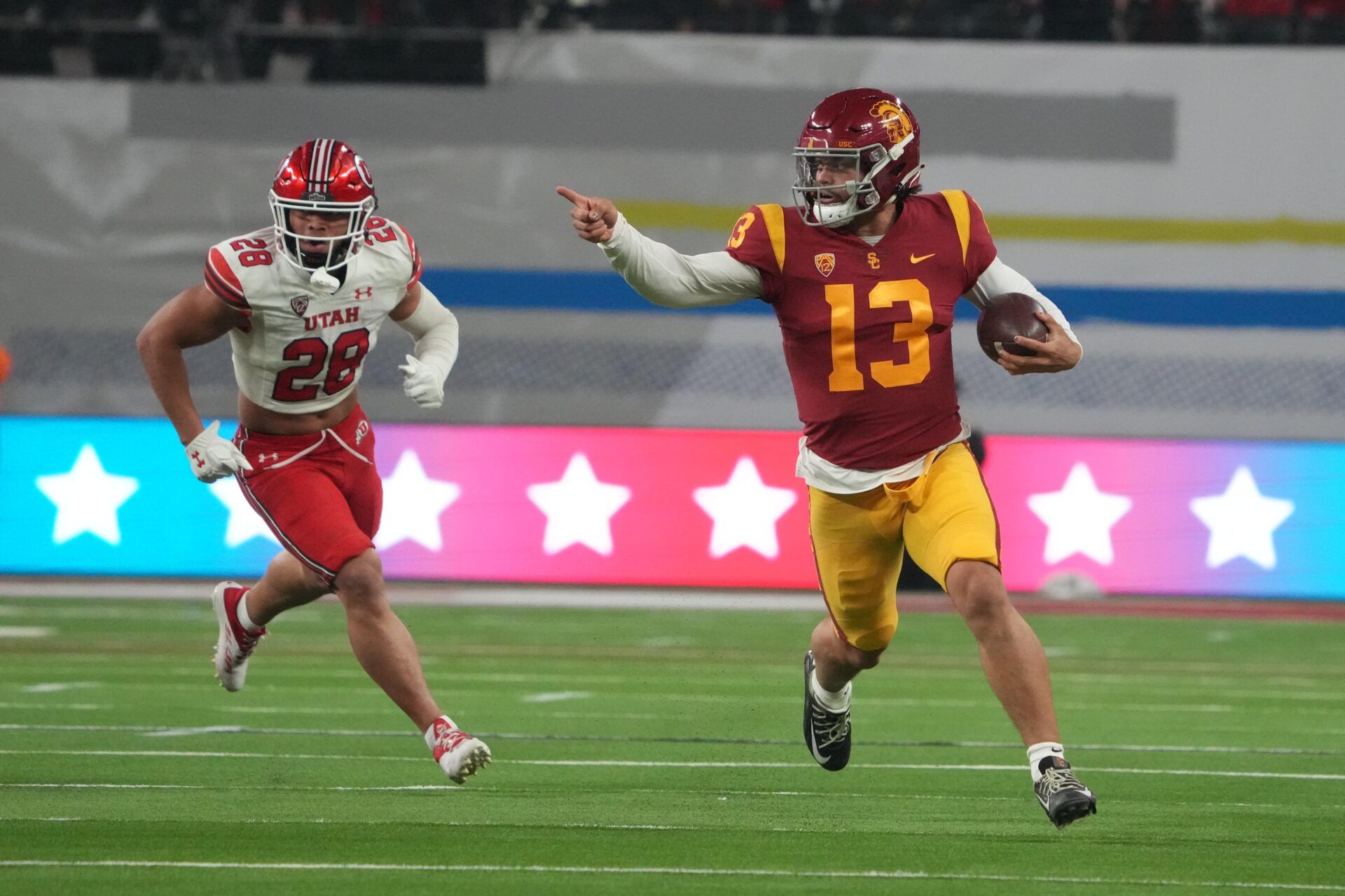 USC Trojans QB Caleb Williams (13) runs with the ball against the Utah Utes.