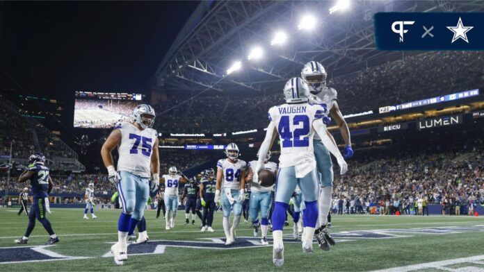 Dallas Cowboys RB Deuce Vaughn (42) celebrates with teammates after scoring a touchdown.