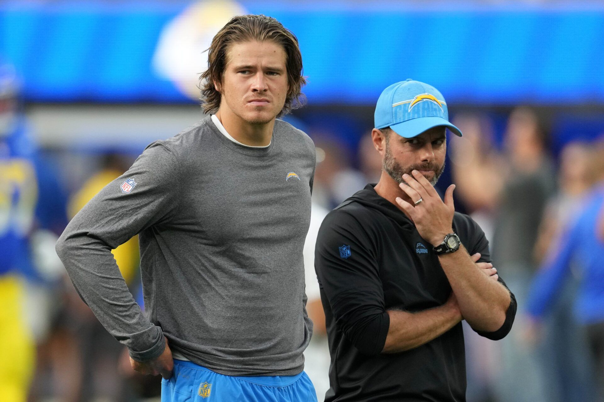 Los Angeles Chargers QB Justin Herbert and head coach Brandon Staley looking on during the team's first preseason game.