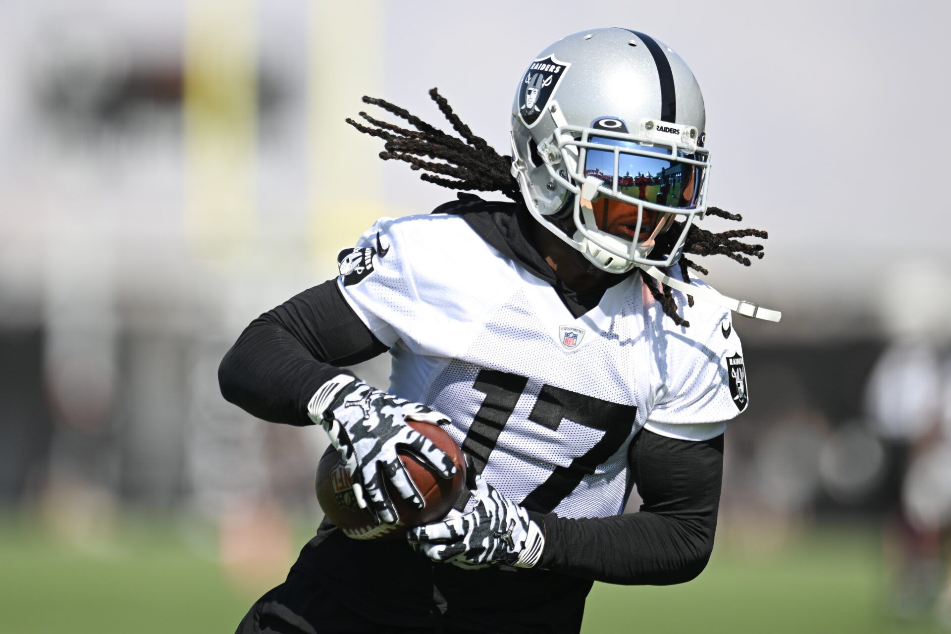 Las Vegas Raiders wide receiver Davante Adams (17) runs a drill during training camp at the Intermountain Health Performance Center.