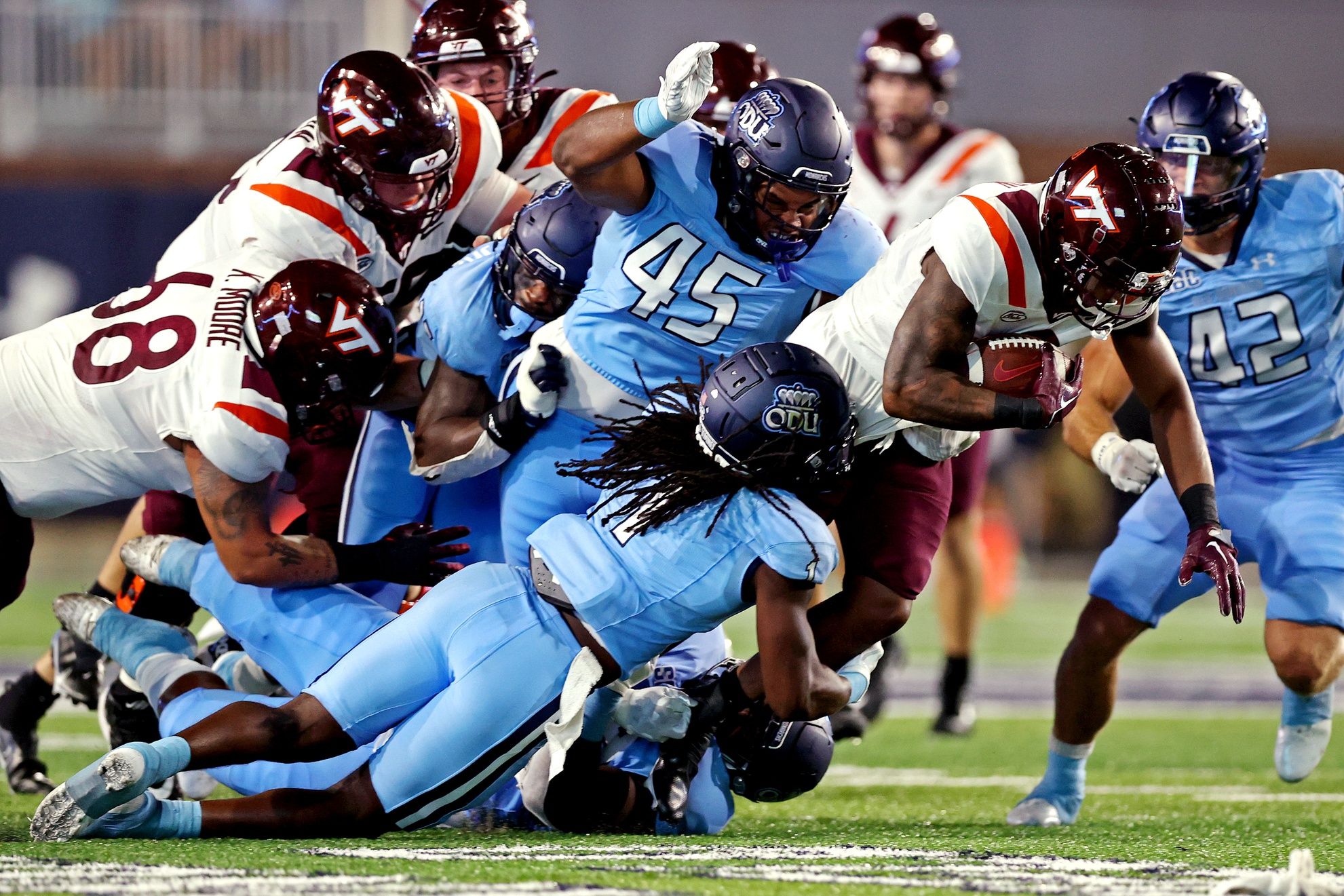 Virginia Tech Hokies running back Jalen Holston (0) runs the ball during the second quarter against Old Dominion Monarchs defensive tackle Denzel Lowry (45) at Kornblau Field at S.B. Ballard Stadium.