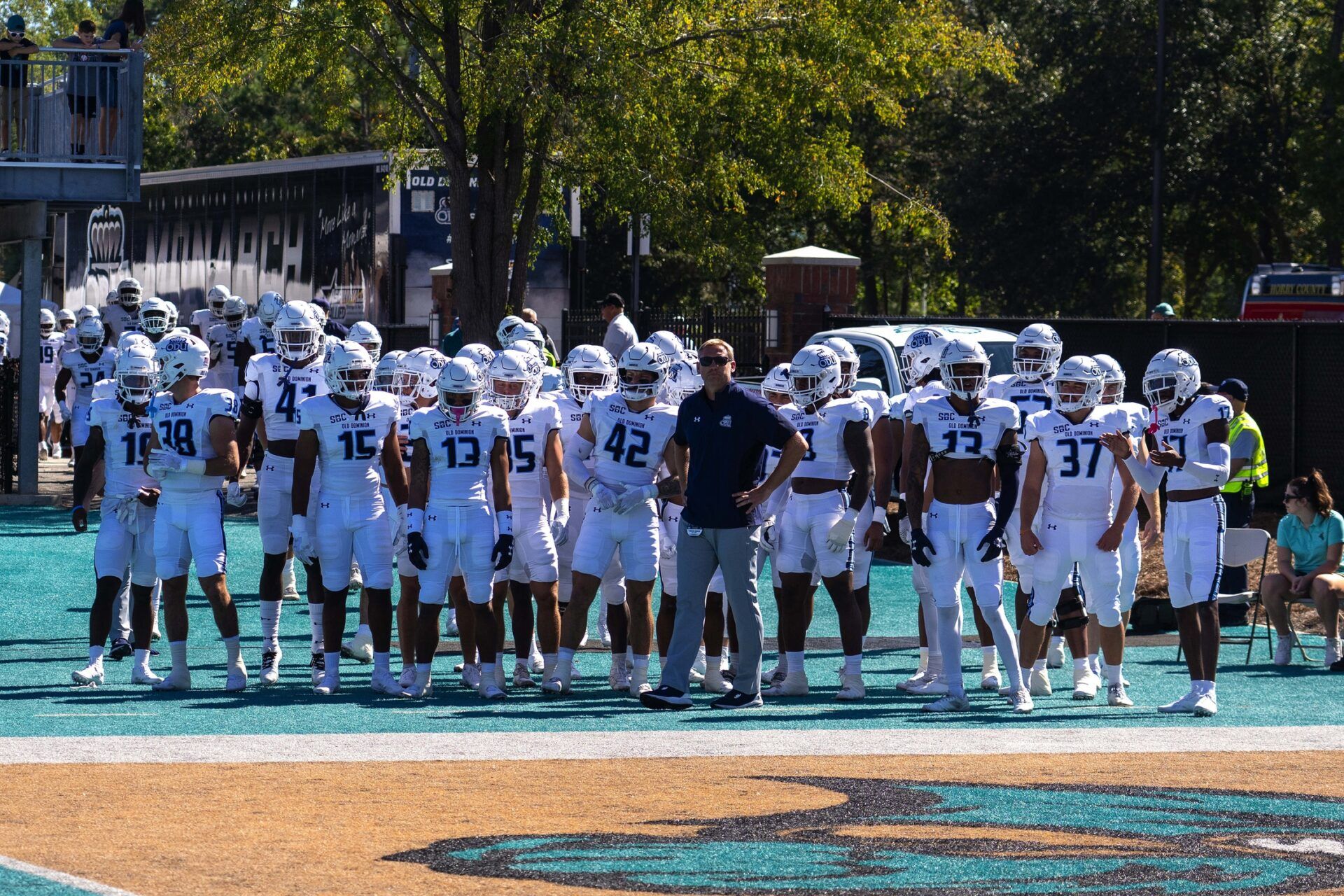 Ricky Rahne brings his team onto the field for a game against the Coastal Carolina Chanticleers at Brooks Stadium.