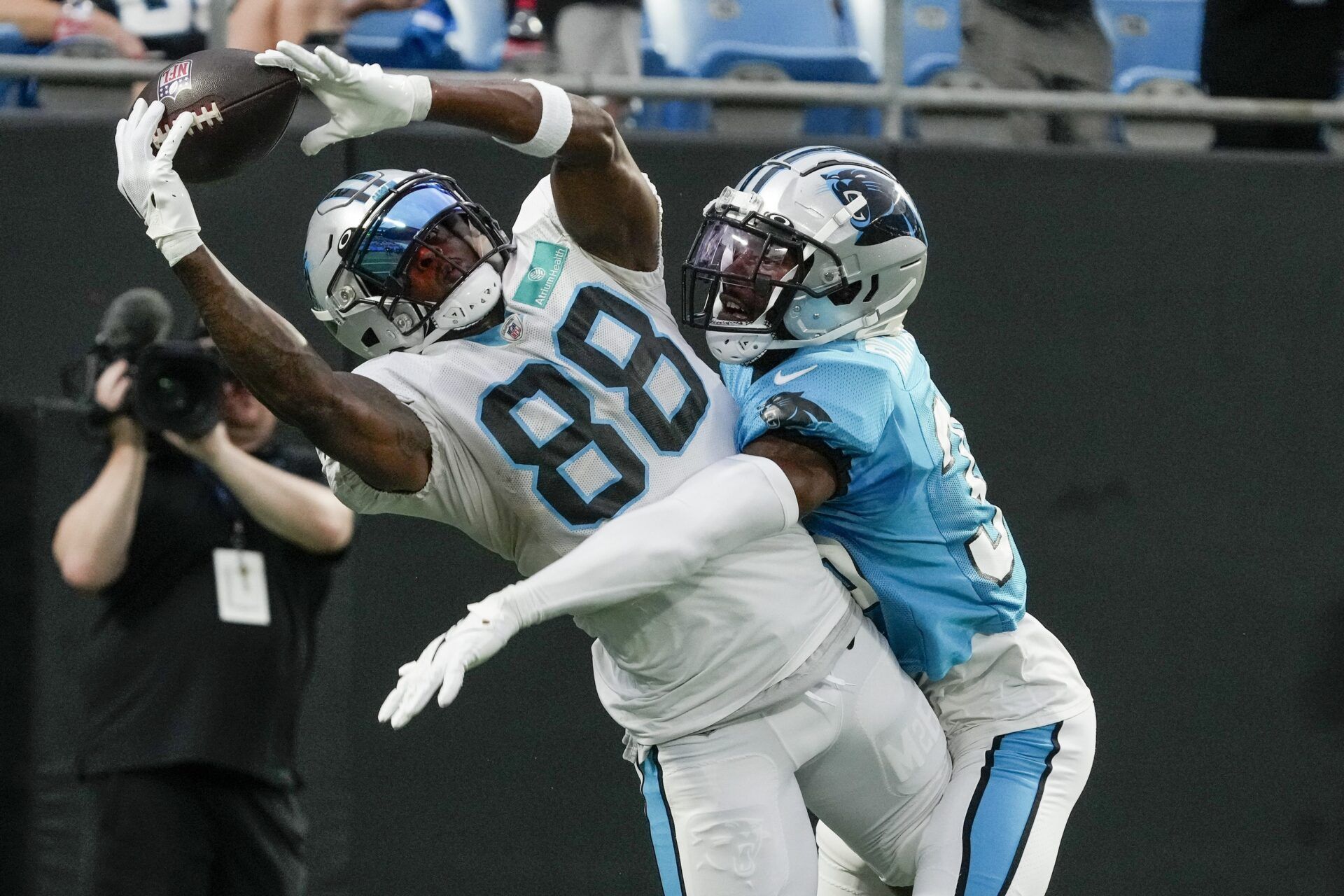 Terrace Marshall Jr. (88) makes a catch defended by cornerback Herb Miller (36) during Carolina Panthers Fan Fest at Bank of America Stadium.