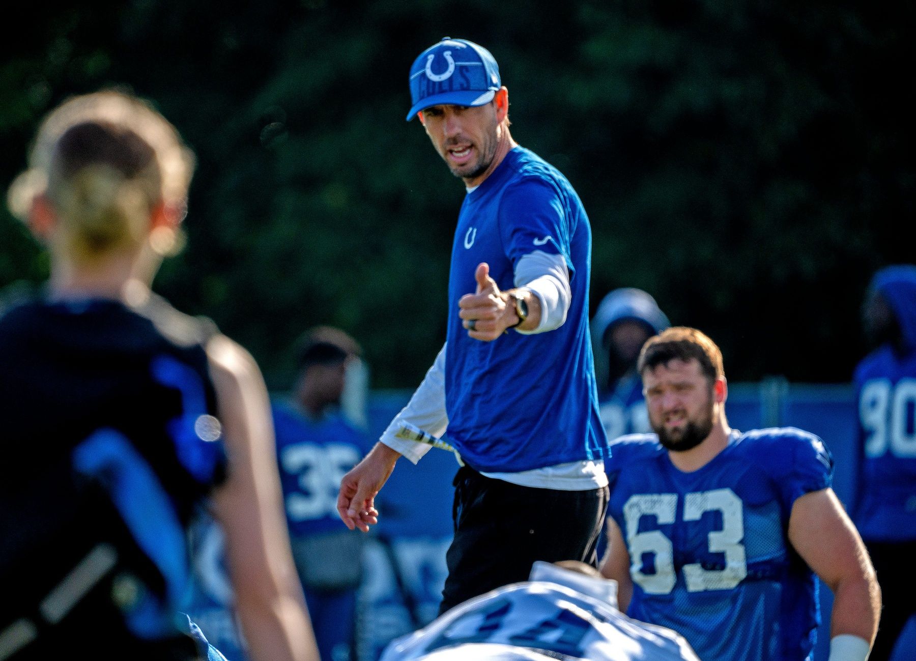 Shane Steichen greets warming-up players during day #9 practice of Colts Camp.