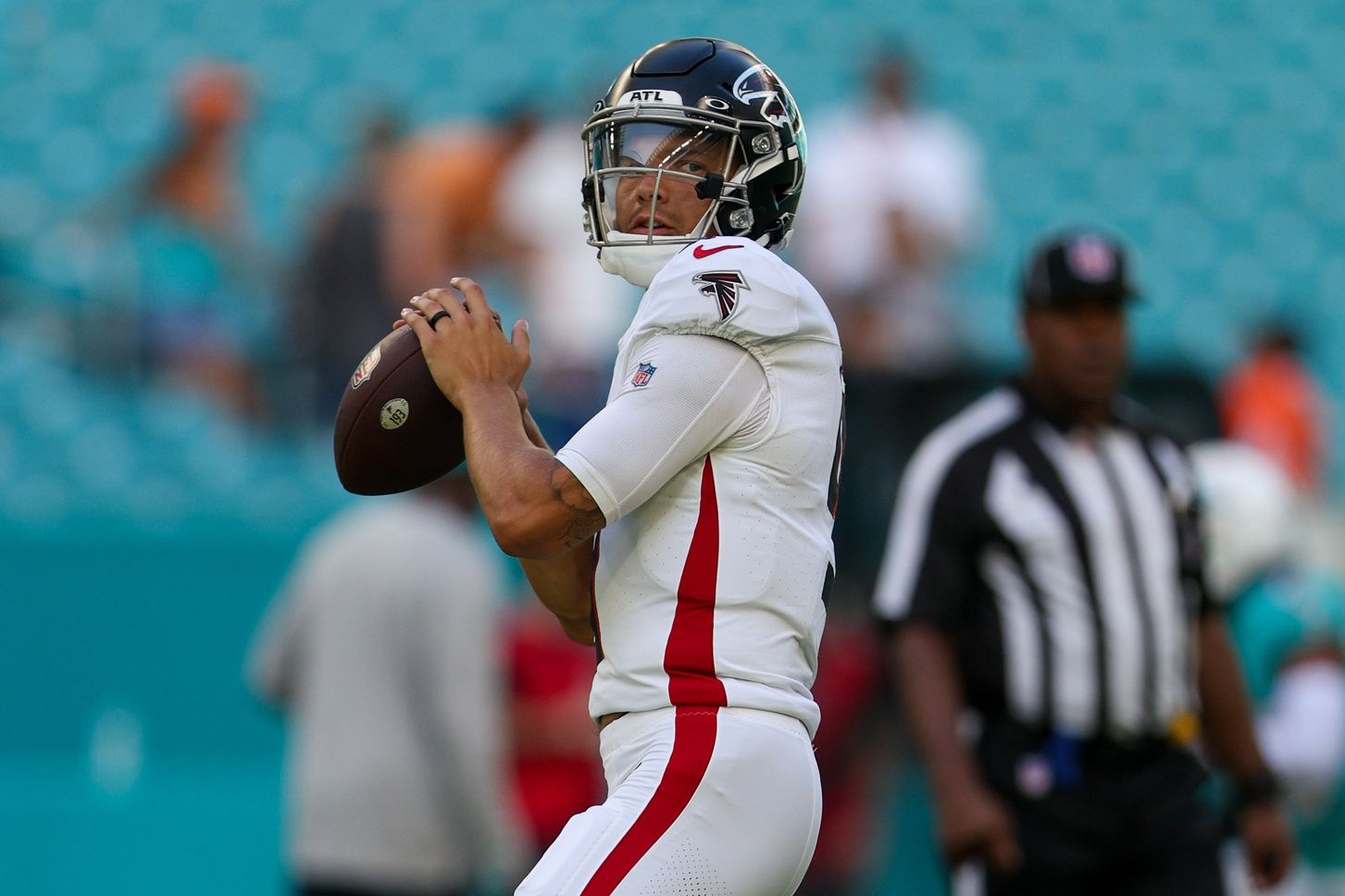 Desmond Ridder (9) warms up before a game against the Miami Dolphins at Hard Rock Stadium.