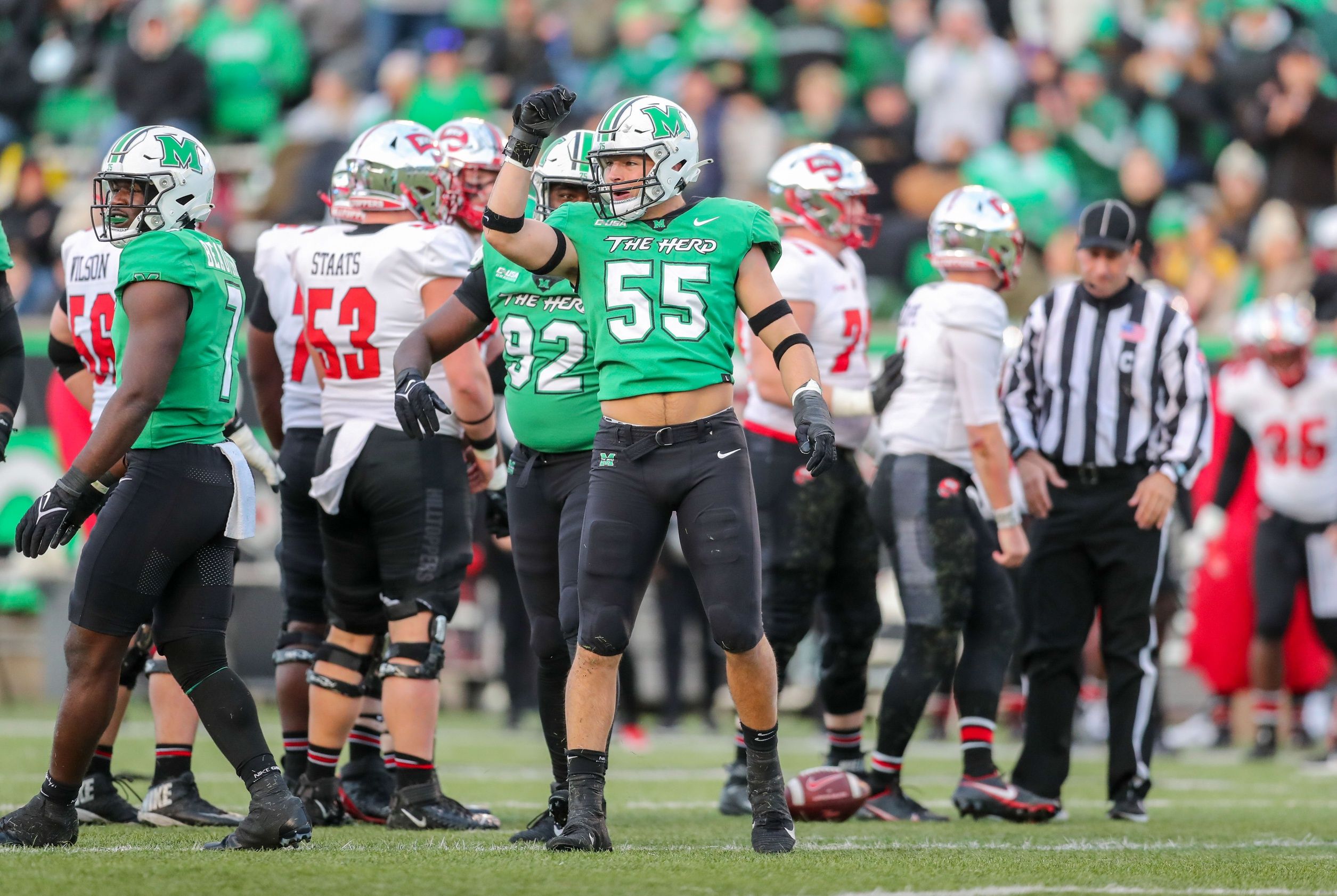 Owen Porter (55) celebrates following a defensive stop during the second quarter against the Western Kentucky Hilltoppers at Joan C. Edwards Stadium.