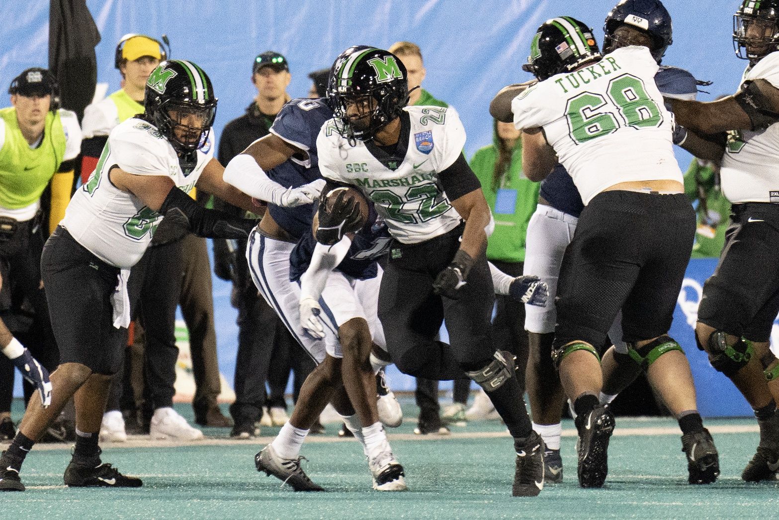 Rasheen Ali (22) breaks a tackle in the second half against the Connecticut Huskies at Brooks Stadium.