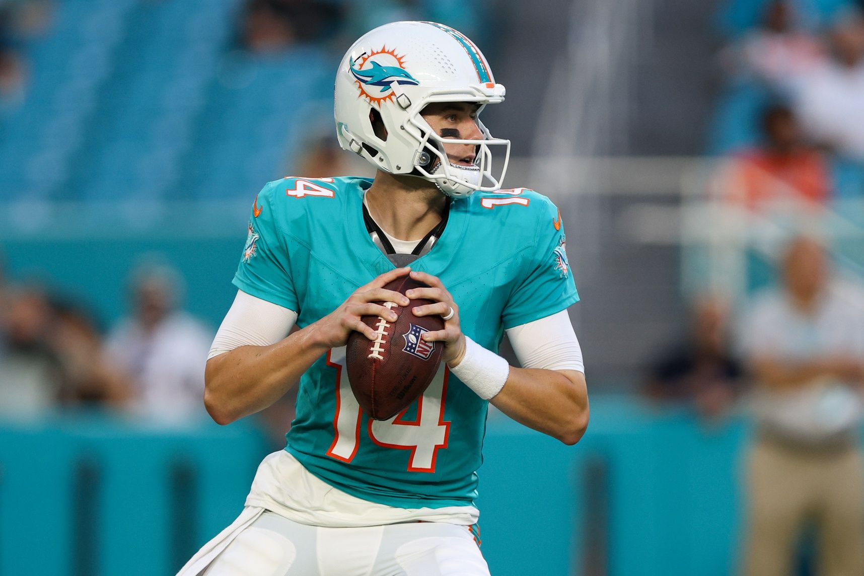 Mike White (14) drops back to pass against the Atlanta Falcons in the first quarter at Hard Rock Stadium.