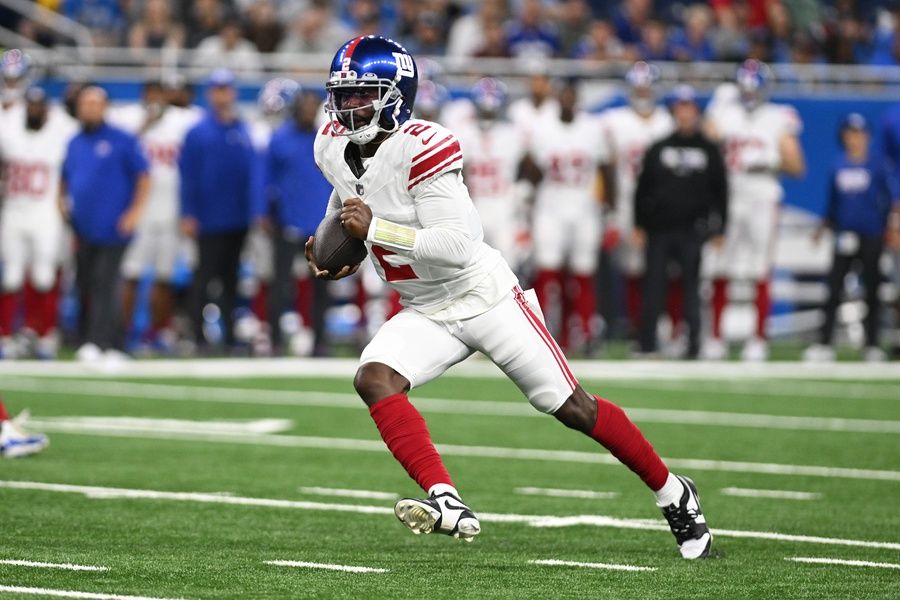 Tyrod Taylor (2) runs upfield against the Detroit Lions in the first quarter at Ford Field.