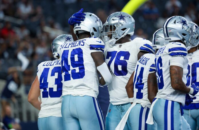 John Stephens Jr. (49) celebrates with teammates after scoring a touchdown during the second half against the Jacksonville Jaguars at AT&T Stadium.