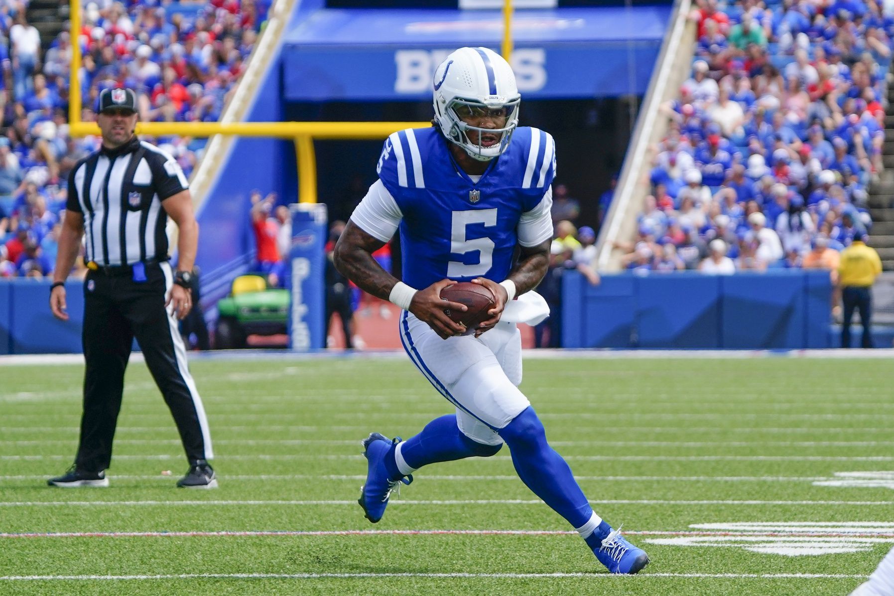 Anthony Richardson (5) runs with the ball against the Buffalo Bills during the first half at Highmark Stadium.