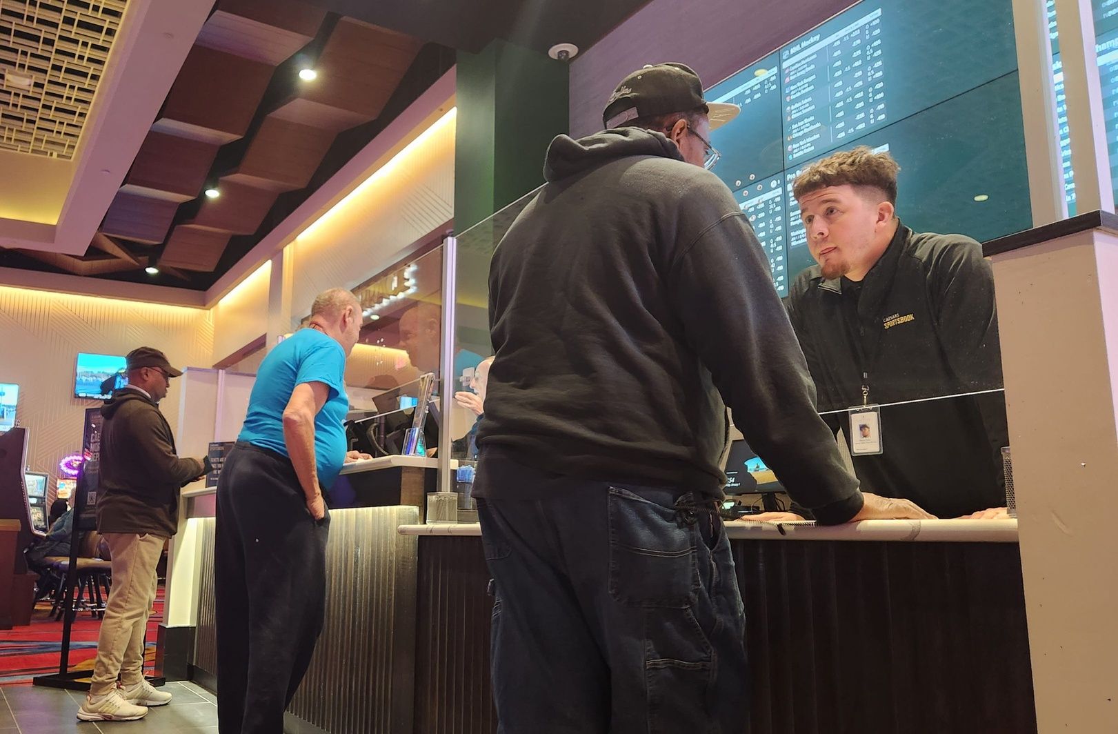 Customers place bets at the physical sportsbook at Eldorado Gaming Scioto Downs on the Far South Side.