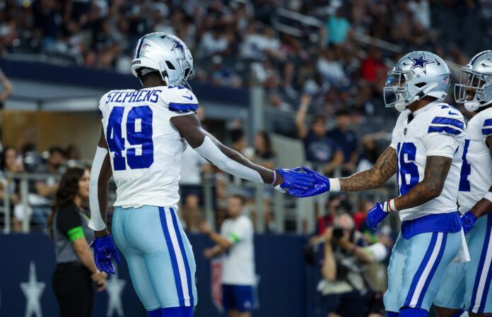 Dallas Cowboys wide receiver John Stephens Jr. (49) celebrates with Dallas Cowboys wide receiver Jalen Moreno-Cropper (16) after scoring a touchdown during the second half against the Jacksonville Jaguars at AT&T Stadium.