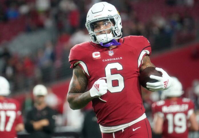 Arizona Cardinals RB James Conner (6) warms up before a game.