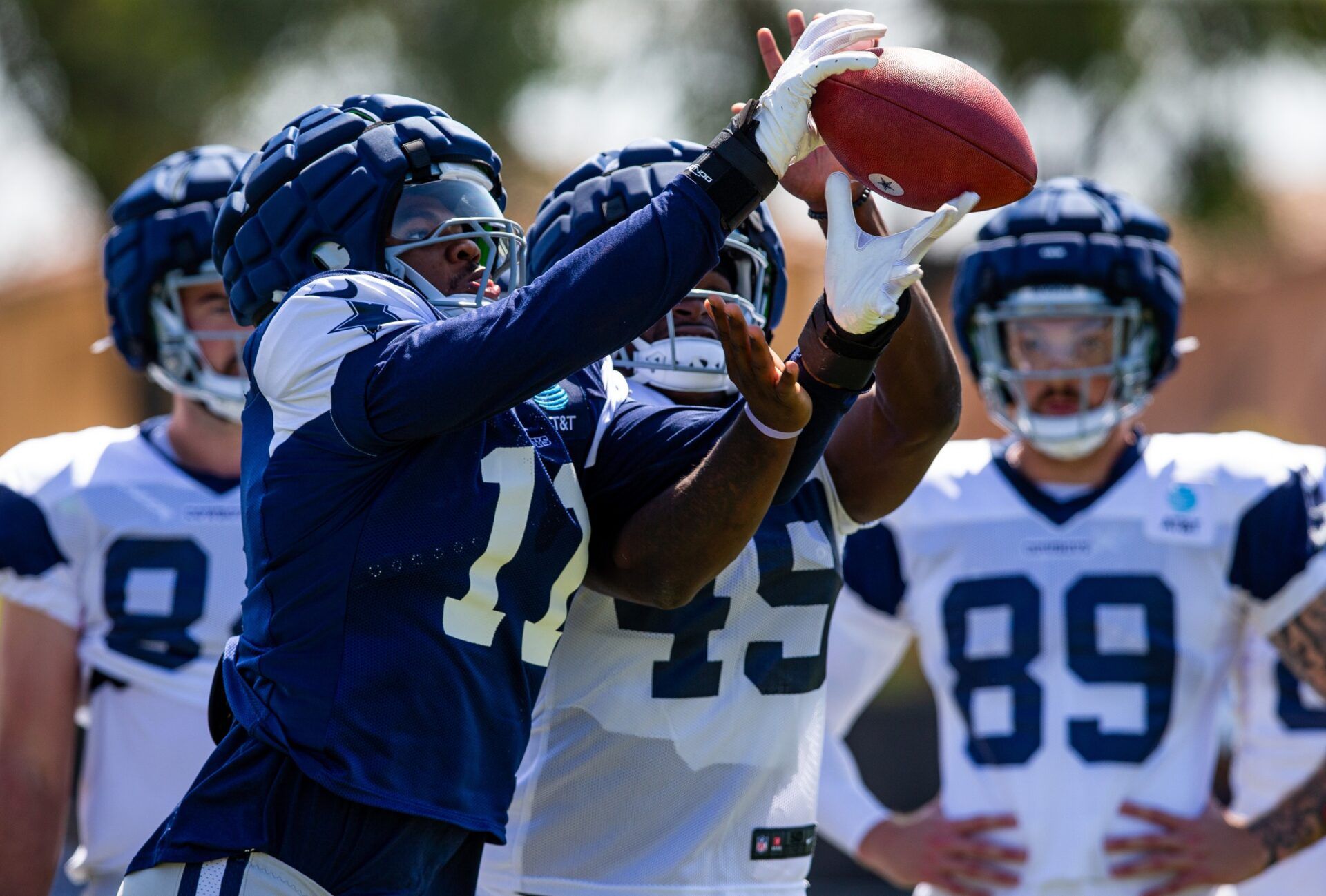 Dallas Cowboys LB Micah Parsons (11) runs a drill with WR John Stephens Jr. (49) during training camp.