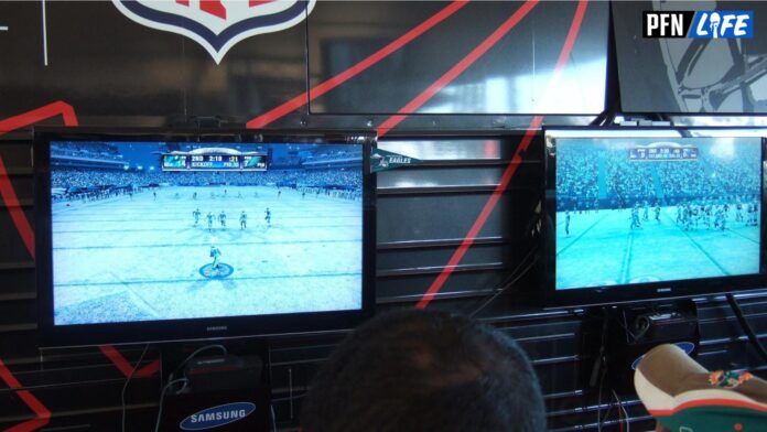 Fans play the NFL Madden video game.