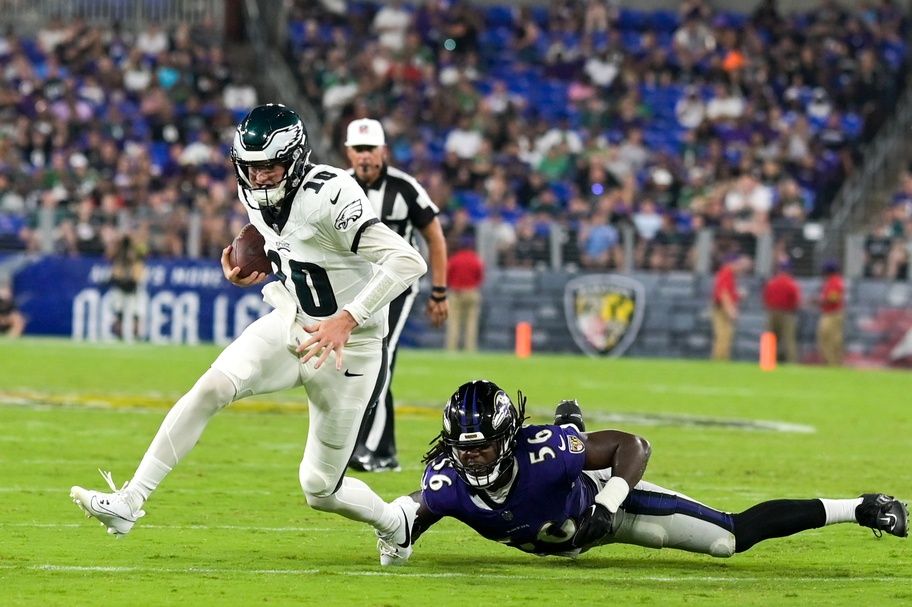 Philadelphia Eagles QB Tanner McKee (10) breaks away from a tackle against the Baltimore Ravens.