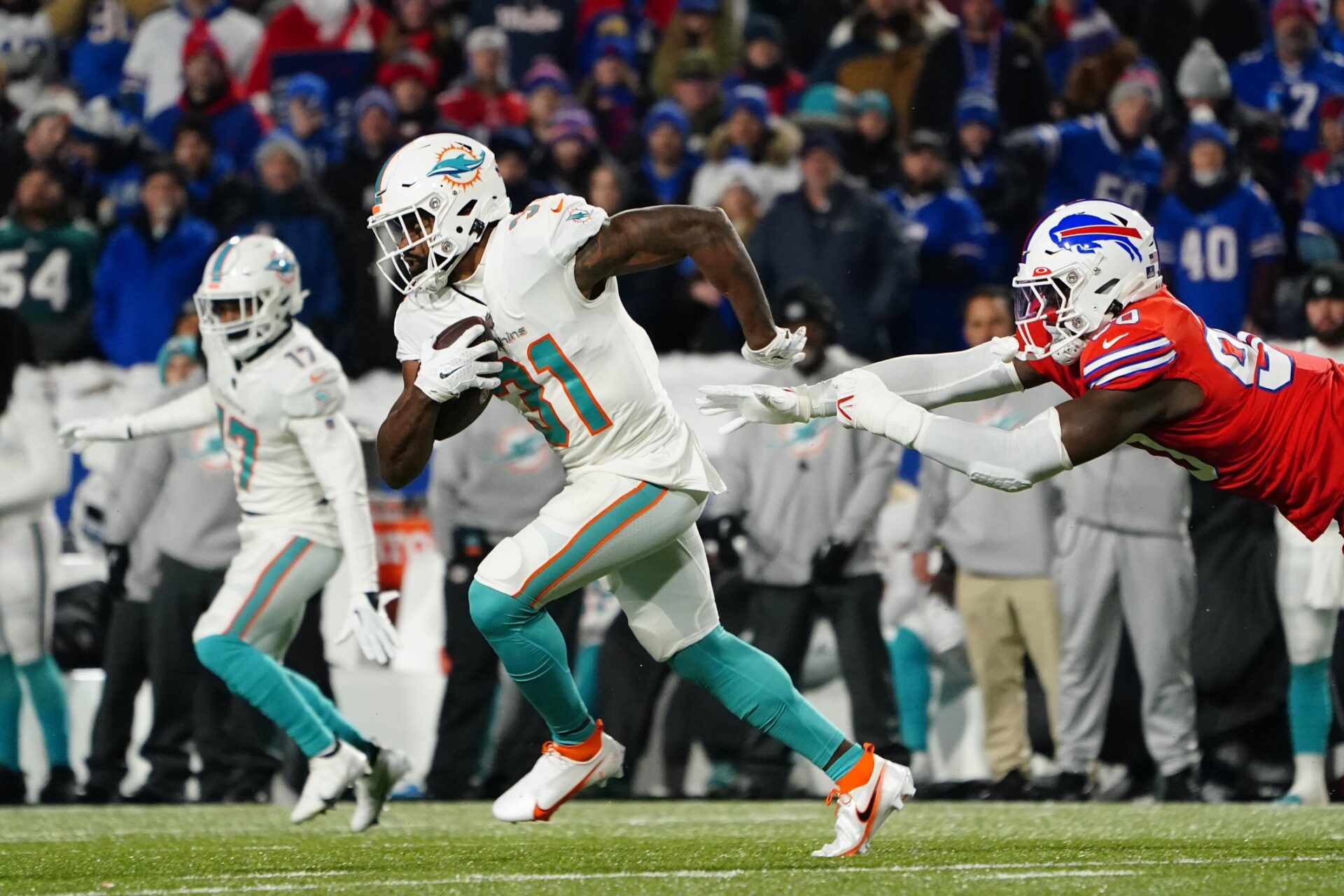 Miami Dolphins RB Raheem Mostert (31) attempts to break a tackle against the Buffalo Bills.