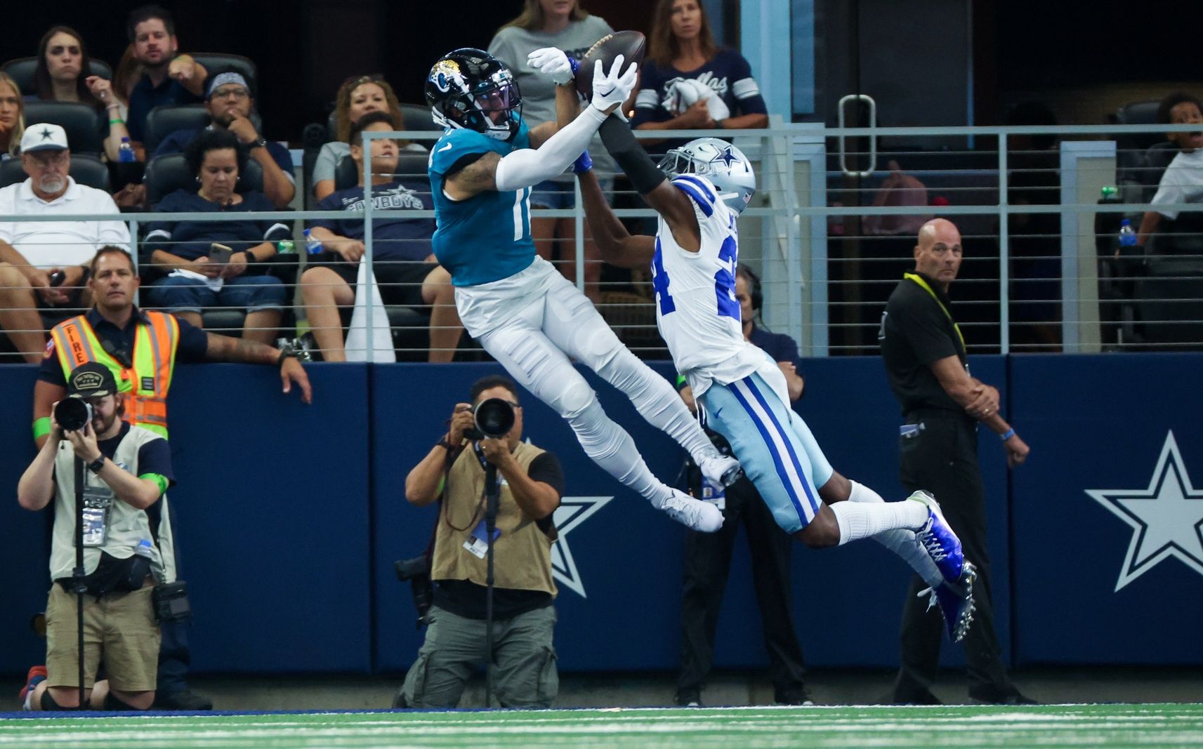 Dallas Cowboys safety Israel Mukuamu (24) defends a pass intended for Jacksonville Jaguars wide receiver Parker Washington (11) during the second quarter at AT&T Stadium. 