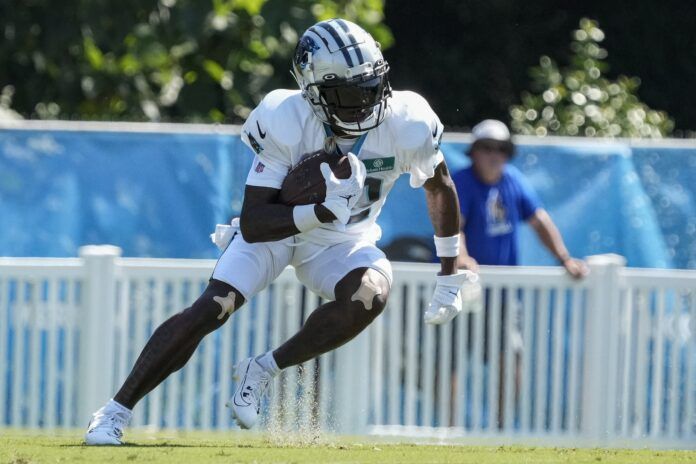 Jonathan Mingo (15) runs back a kick during training camp at Wofford College.