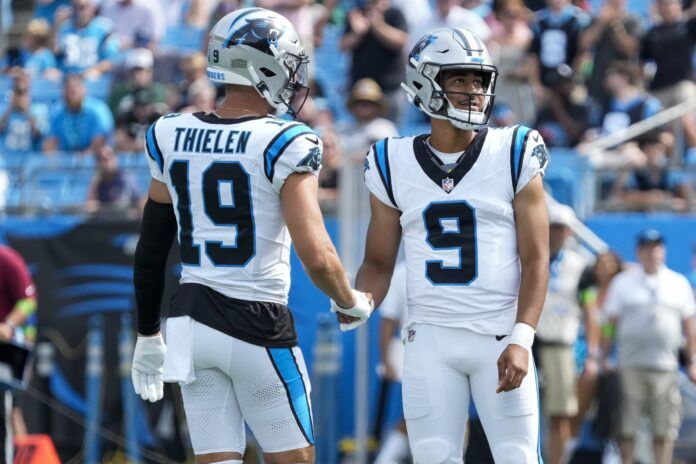 Adam Thielen (19) shakes hands with quarterback Bryce Young (9) during the first quarter against the New York Jets at Bank of America Stadium.