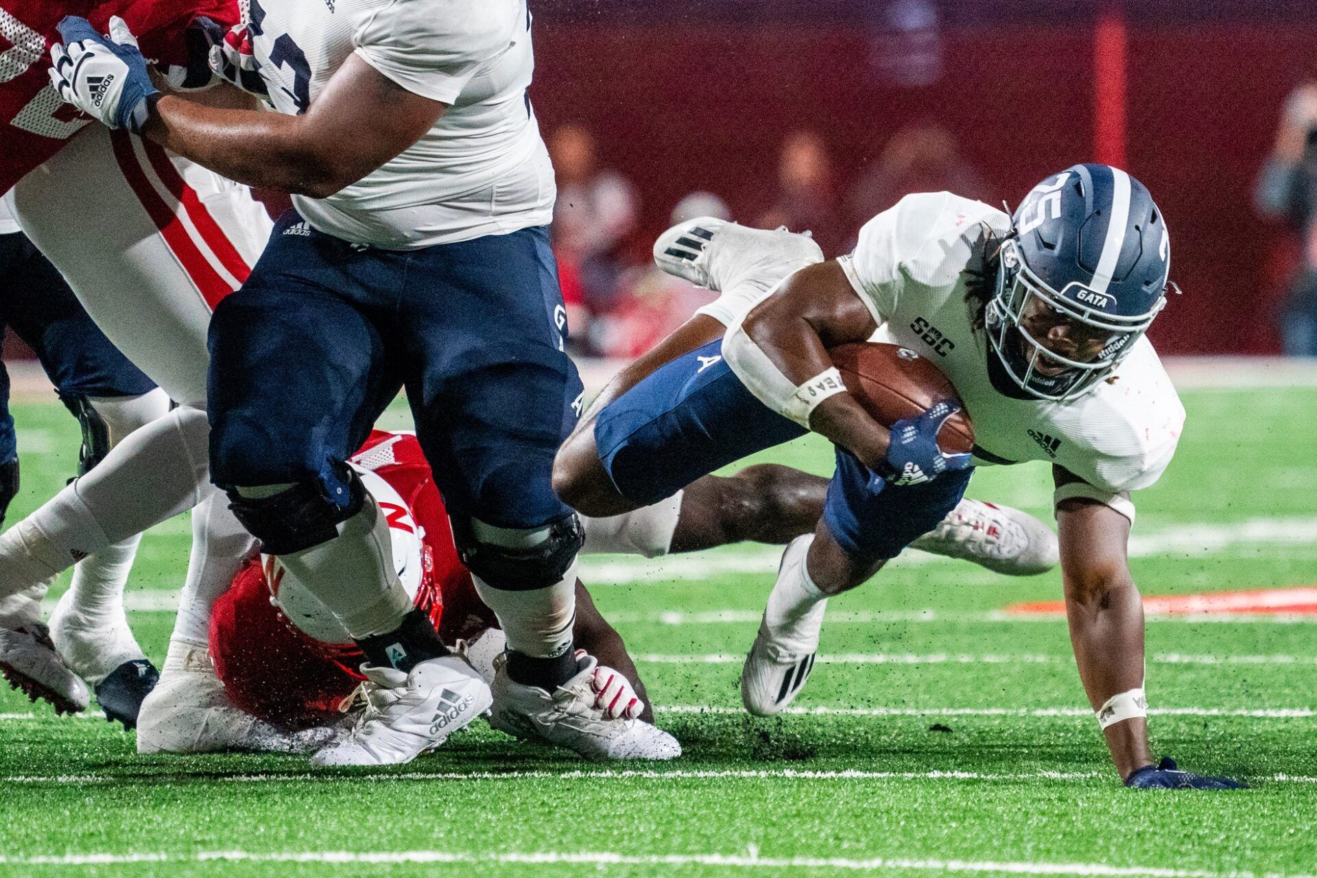 Jalen White (25) dives with the ball against the Nebraska Cornhuskers during the fourth quarter at Memorial Stadium.