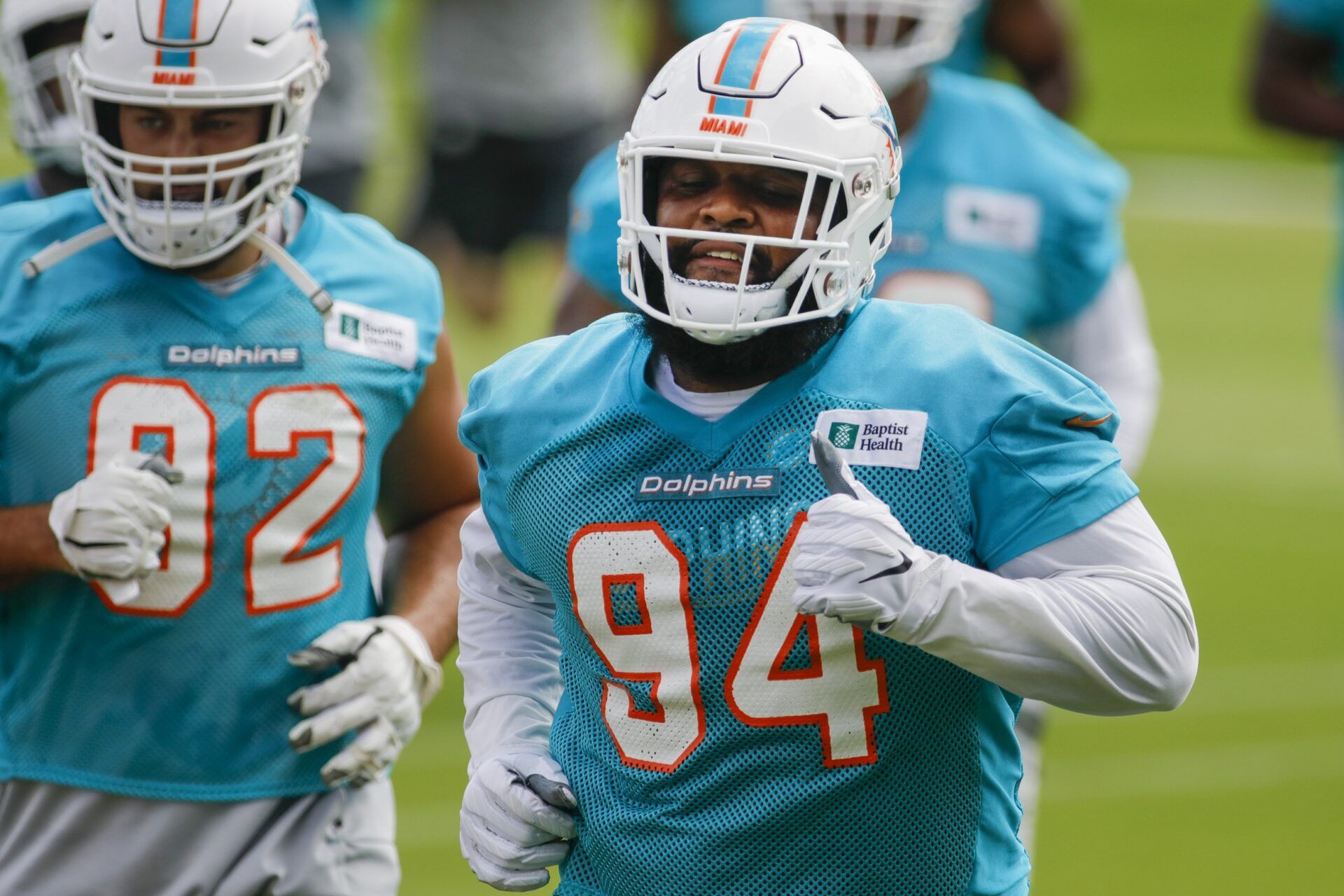 Miami Dolphins DT Christian Wilkins (94) jogs during training camp.