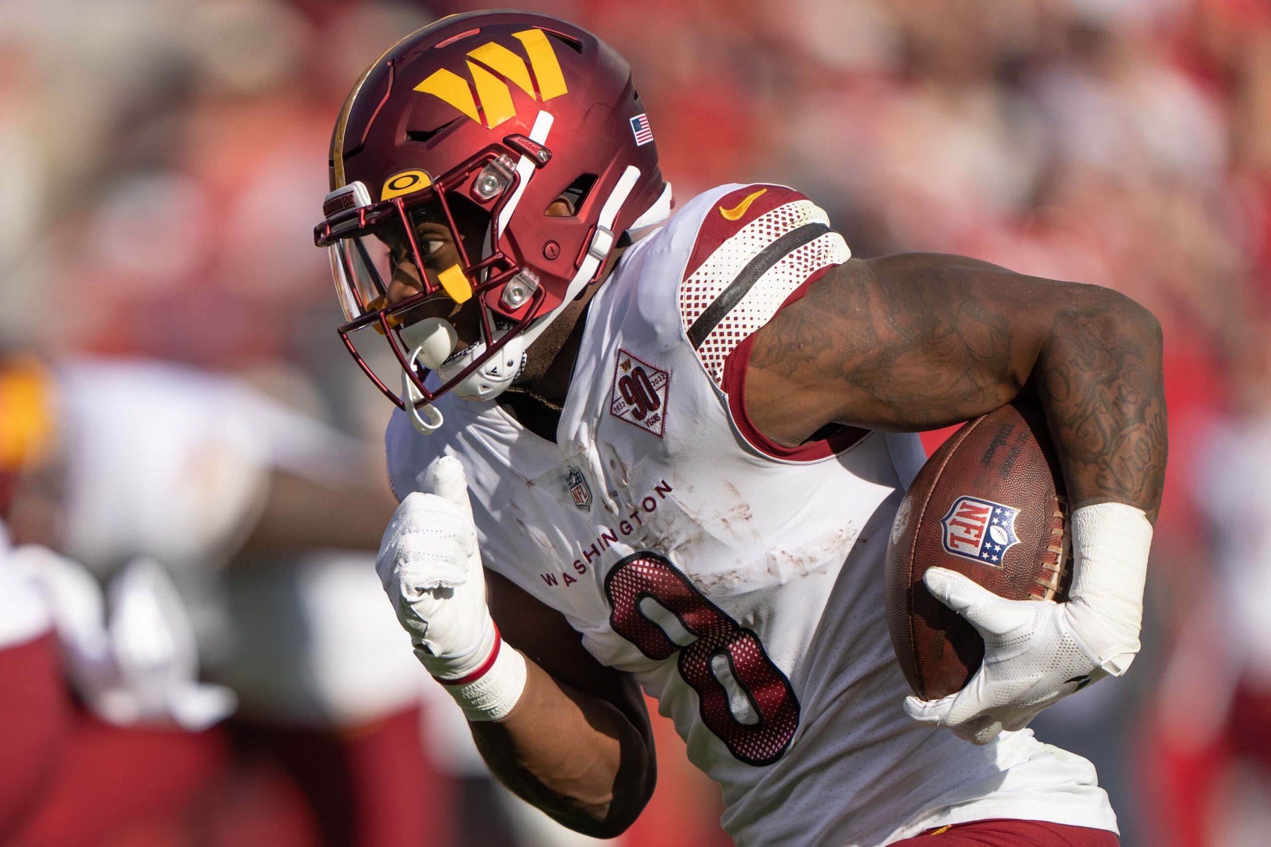 Washington Commanders RB Brian Robinson Jr. (8) runs with the ball.