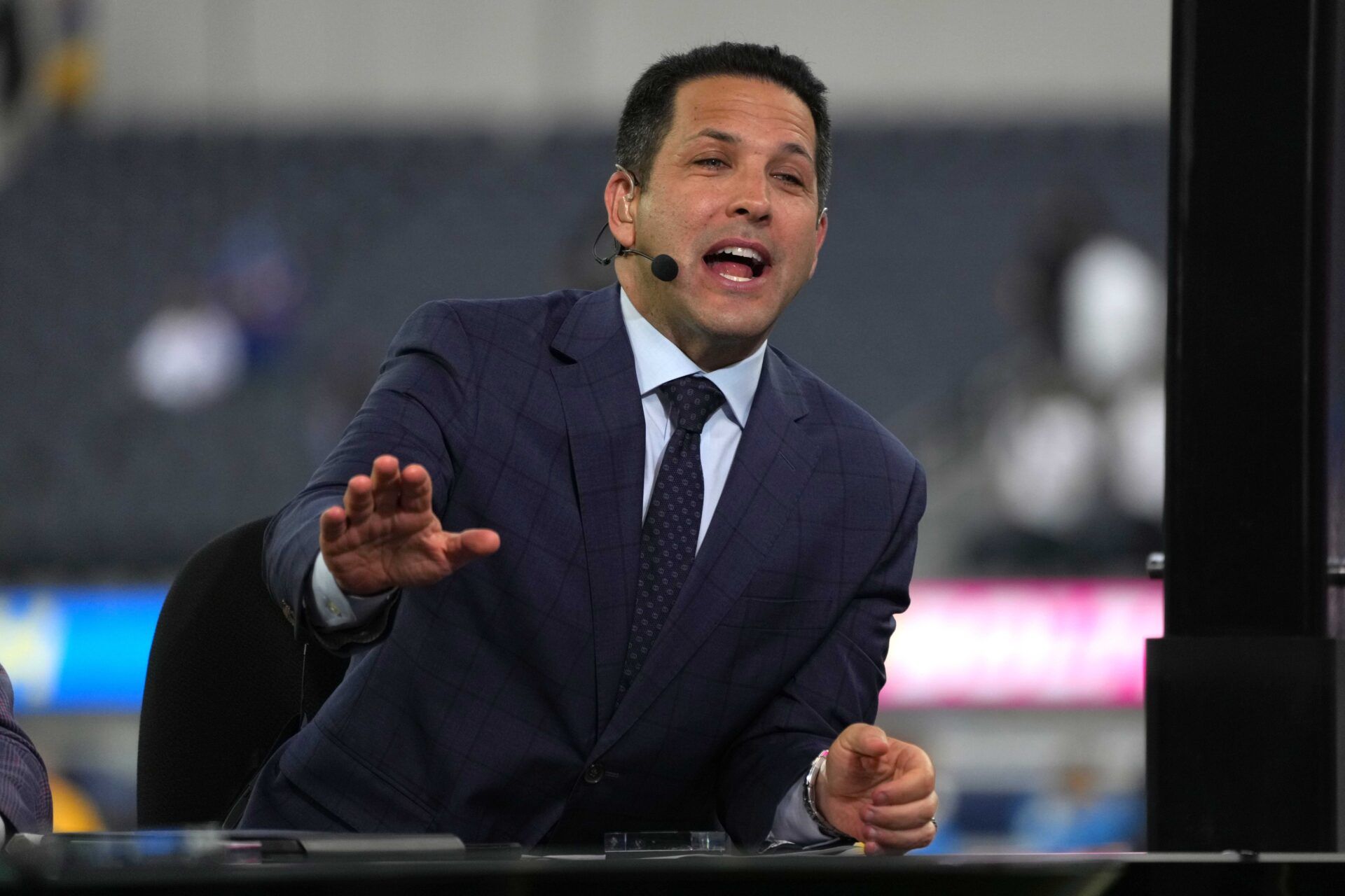 Adam Schefter broadcasts from the ESPN Monday Night Football Countdown set before a game.