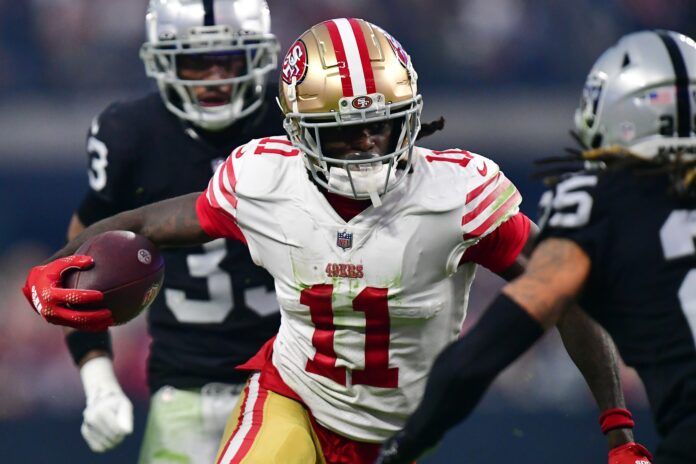 San Francisco 49ers WR Brandon Aiyuk (11) runs with the ball against the Las Vegas Raiders.