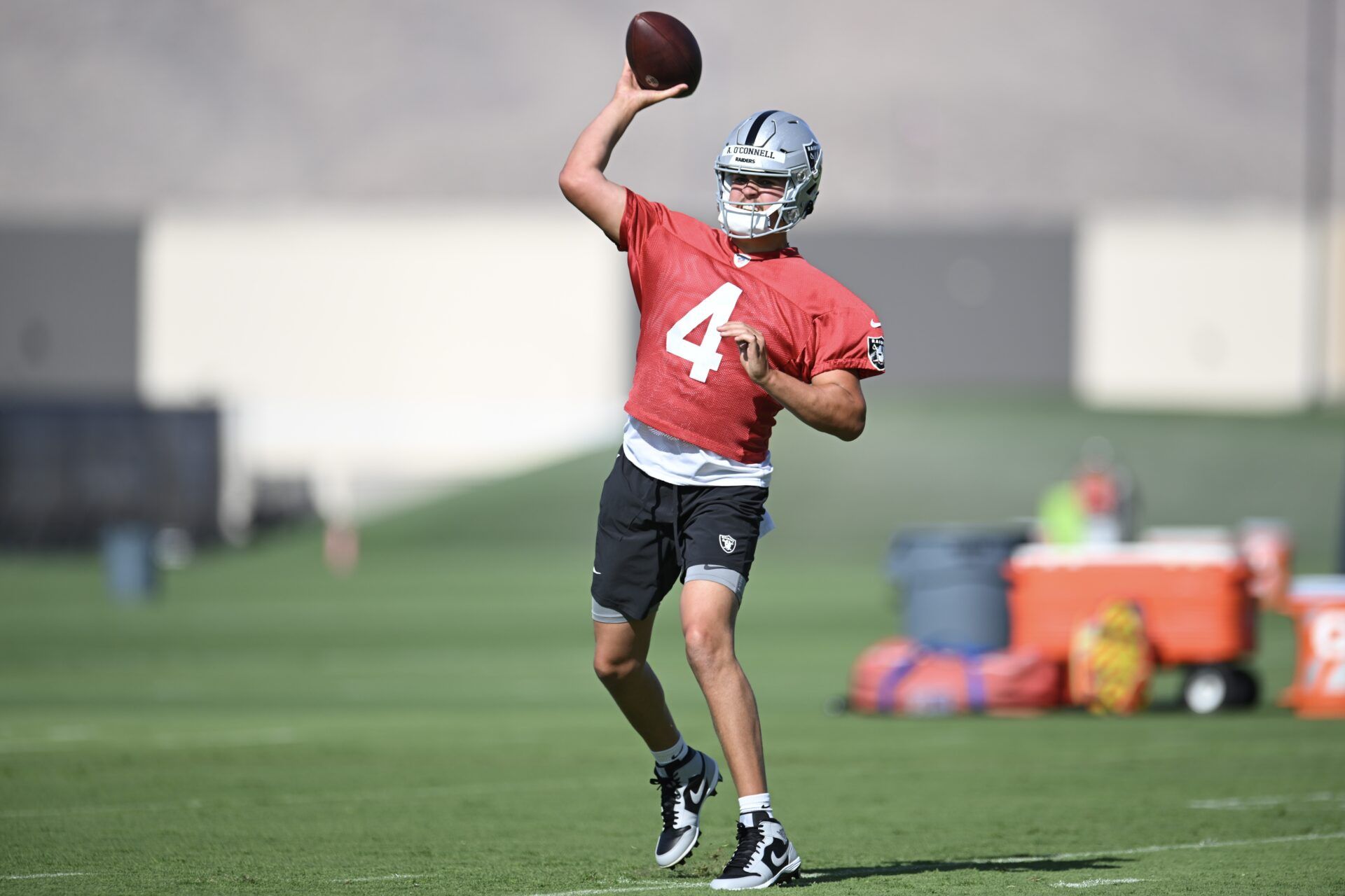 Las Vegas Raiders QB Aidan O'Connell (4) throws a pass during training camp.